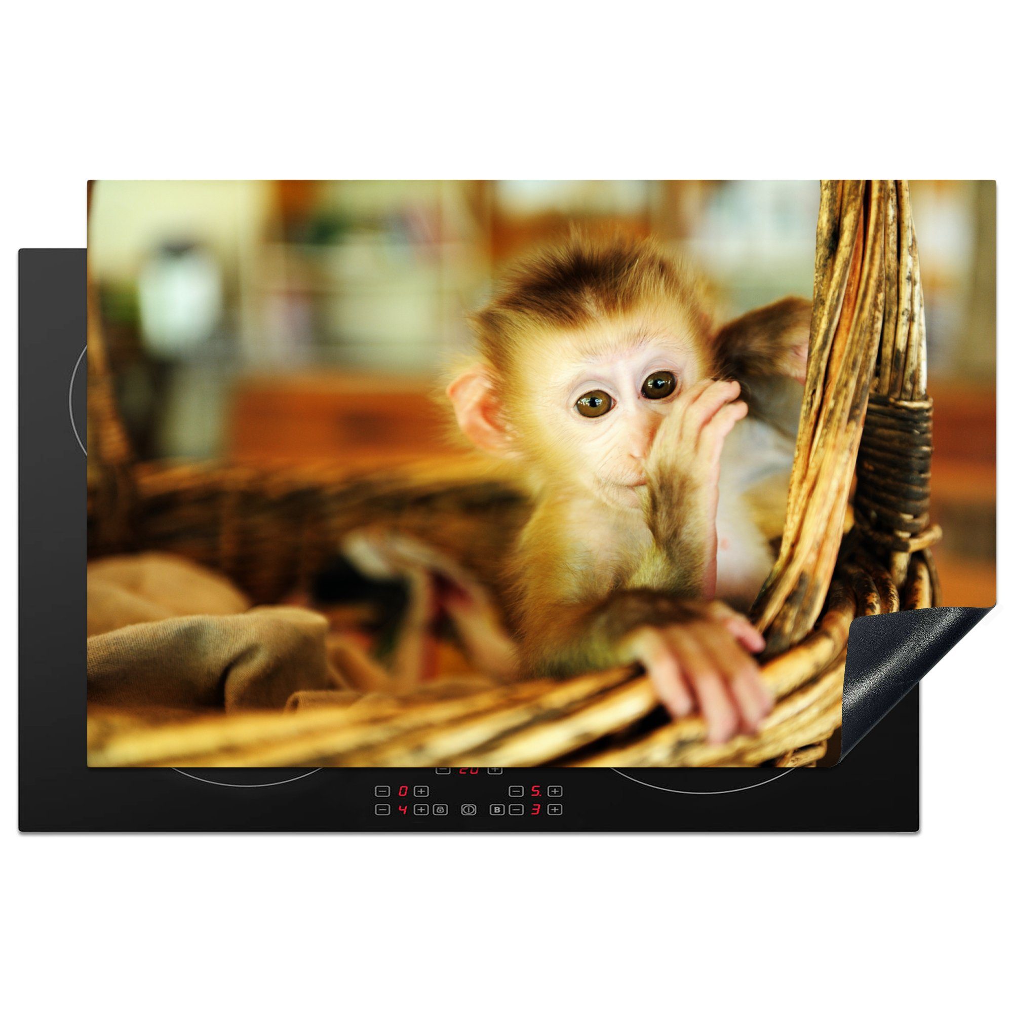 MuchoWow Herdblende-/Abdeckplatte Baby-Affe in einem Weidenkorb - Junge - Kind - Mädchen - Kinder, Vinyl, (1 tlg), 81x52 cm, Induktionskochfeld Schutz für die küche, Ceranfeldabdeckung