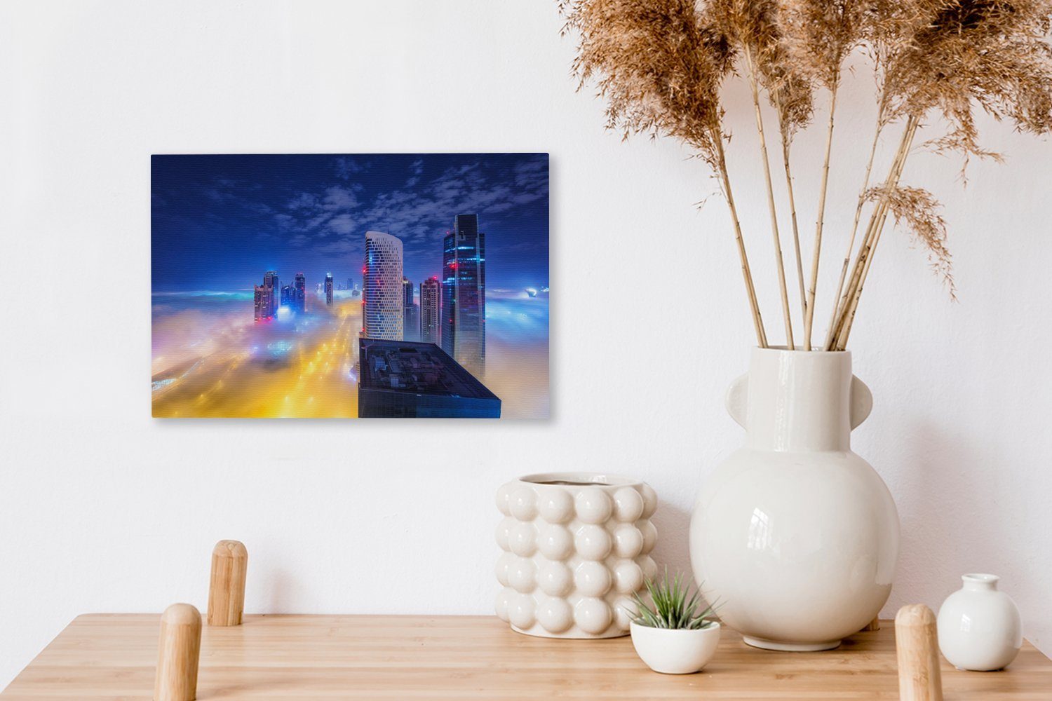 OneMillionCanvasses® Leinwandbild Dubais Hochhaustürme (1 30x20 über Wolken St), Leinwandbilder, bei cm Nacht, Wandbild den Aufhängefertig, Wanddeko