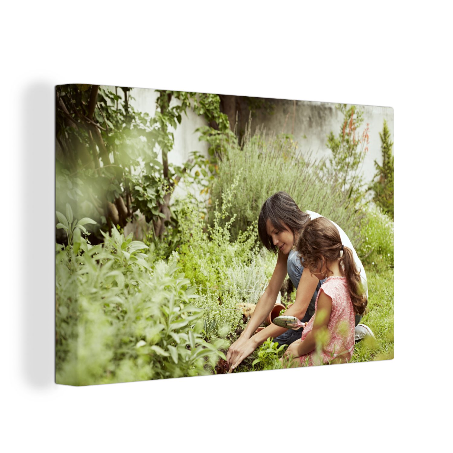 OneMillionCanvasses® Leinwandbild Mutter und Tochter pflanzen gemeinsam im Garten, (1 St), Wandbild Leinwandbilder, Aufhängefertig, Wanddeko, 30x20 cm
