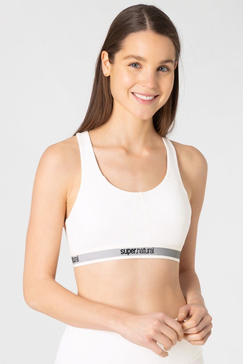 SUPER.NATURAL Sport-BH Merino Bra W FEEL GOOD BRA elastischer Merino-Materialmix Fresh White