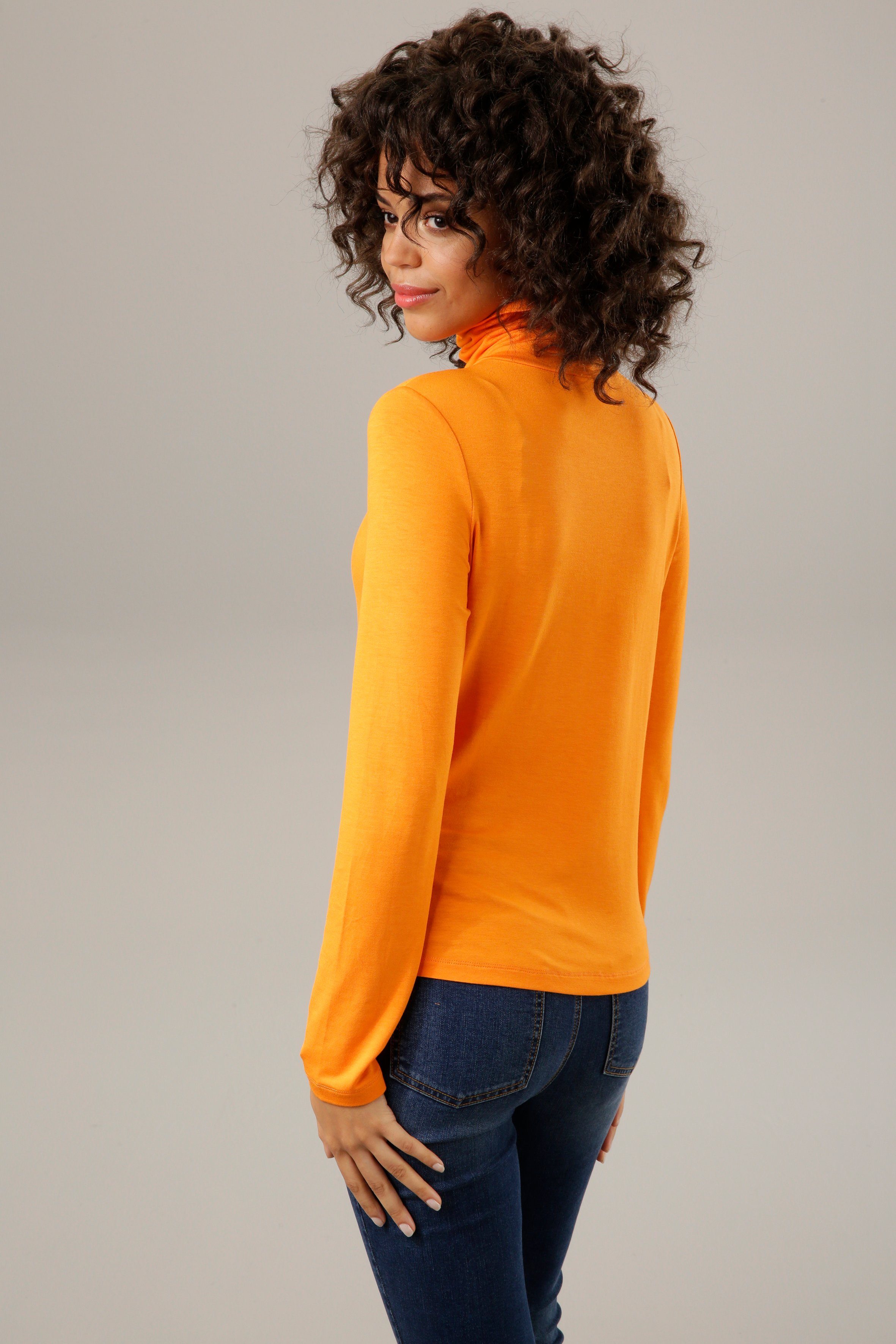 orange oder Unis in 4 CASUAL Rollkragenshirt schwarz-bunt-bedruckt Aniston trendigen