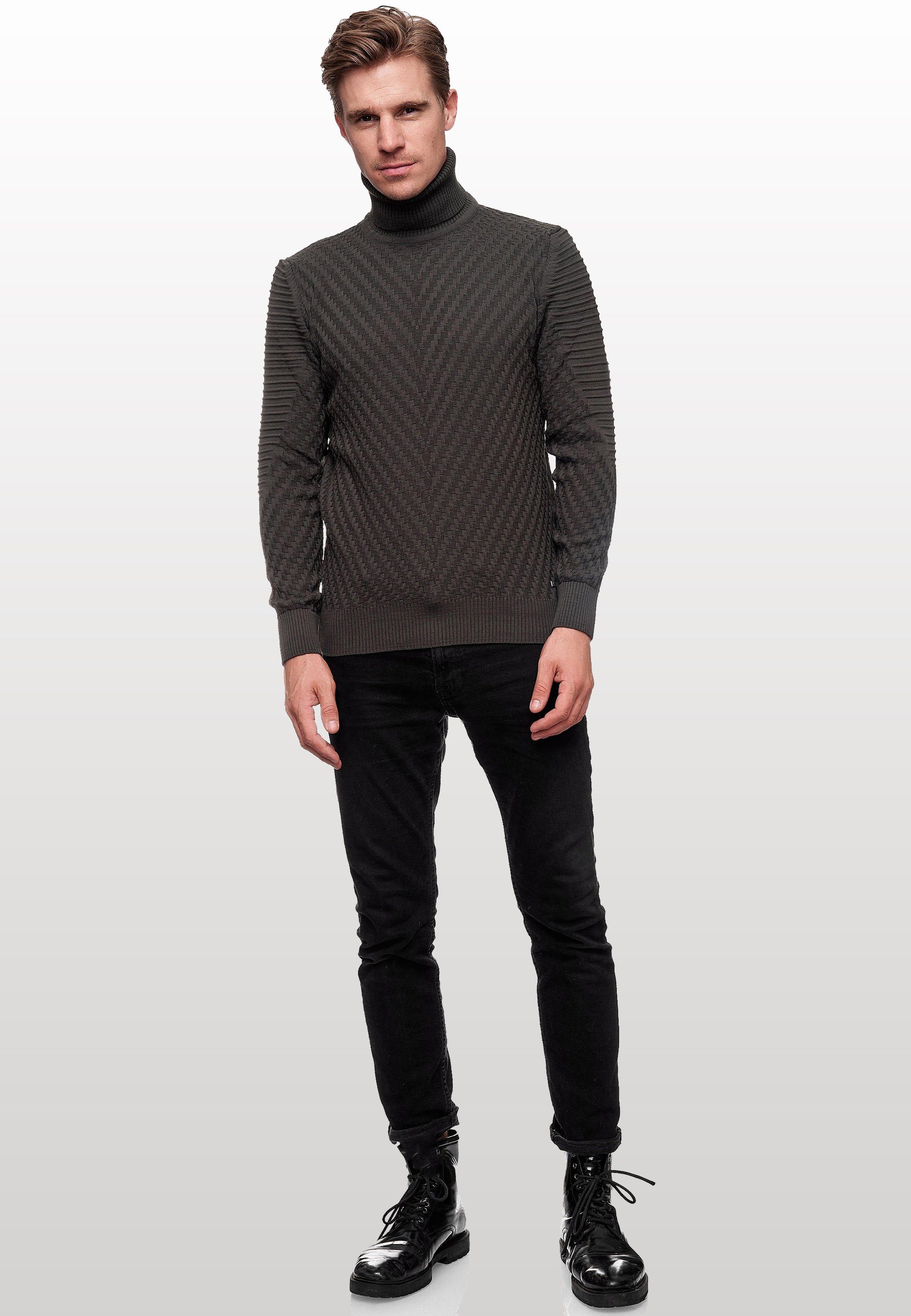 Rusty Neal Rollkragenpullover in stilvollem Feinstrick