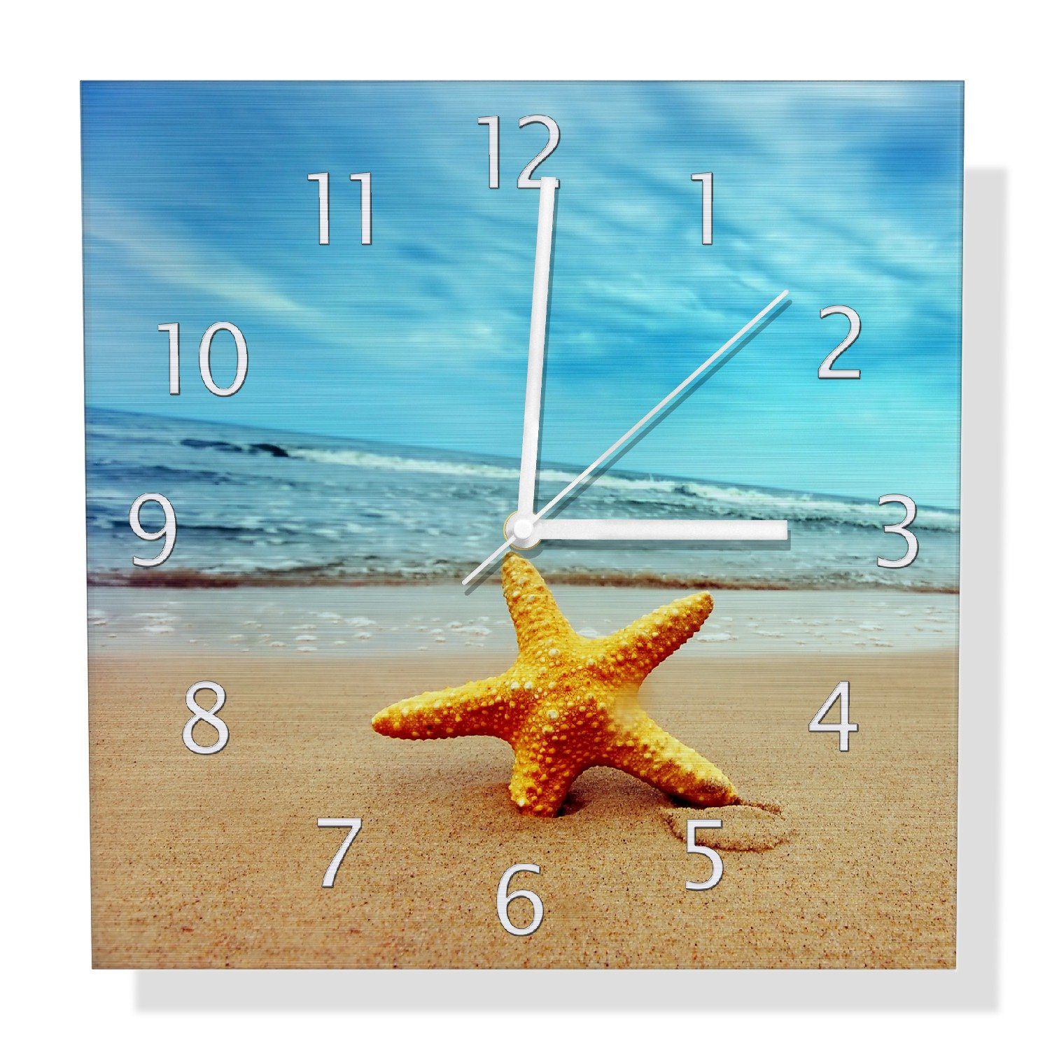 Wanduhr Seestern am Strand am Meer