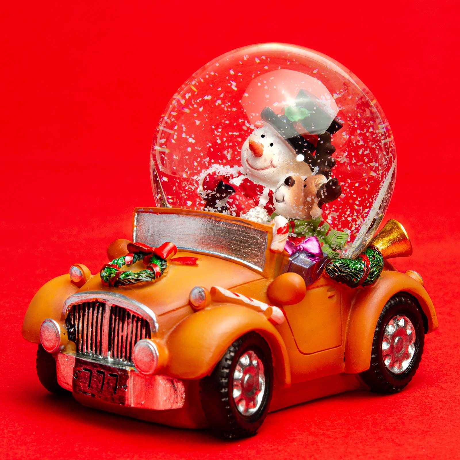 SIKORA Schneekugel SK16 Glas Winter Deko Kugel Schneemann mit Elch im Auto D:6,5cm, Besondere Winterdeko – das perfekte Geschenk für Familie & Freunde