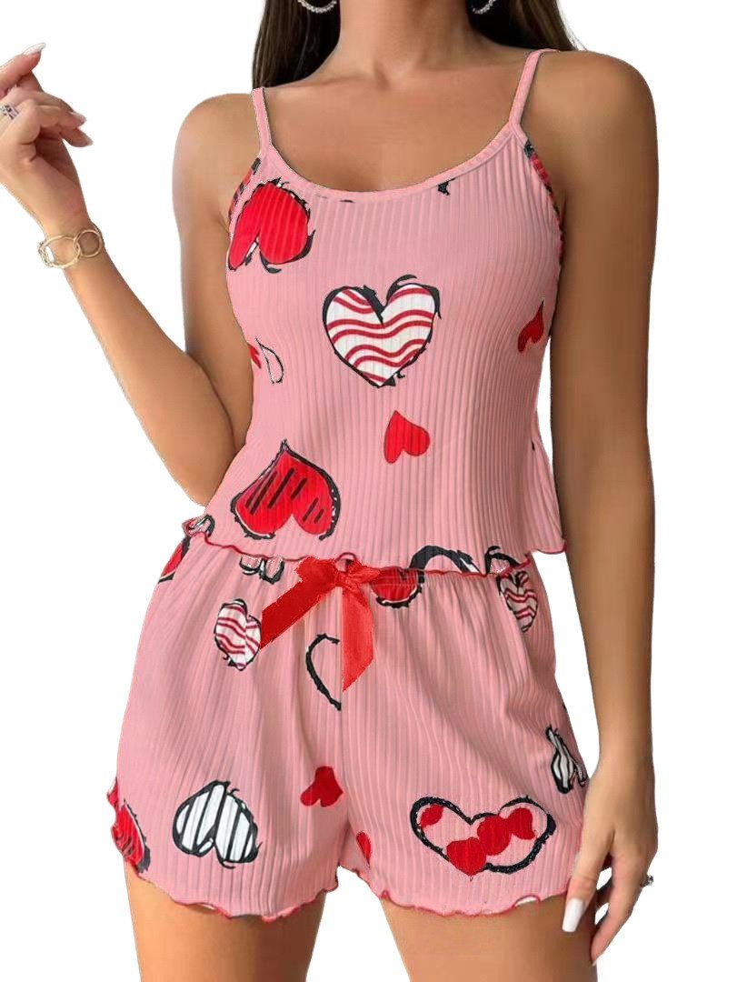 Lovolotti Pyjama Damen Jumpsuit – Sommerlicher Playsuit mit Herz-Print Spaghettiträgern und Schleife