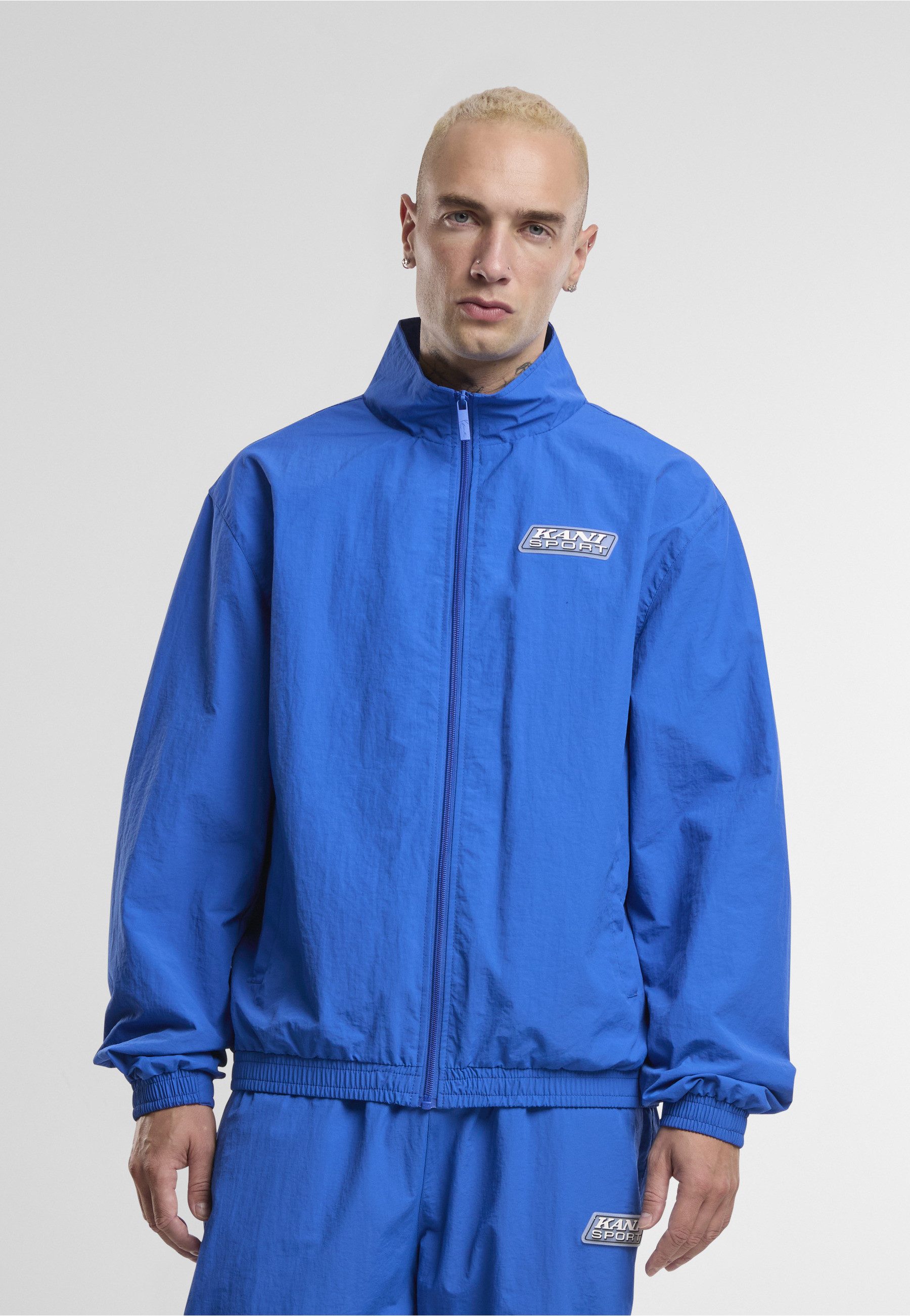 Karl Kani Trainingsjacke Karl Kani Sport Patch Essential Trackjacket (1-St)