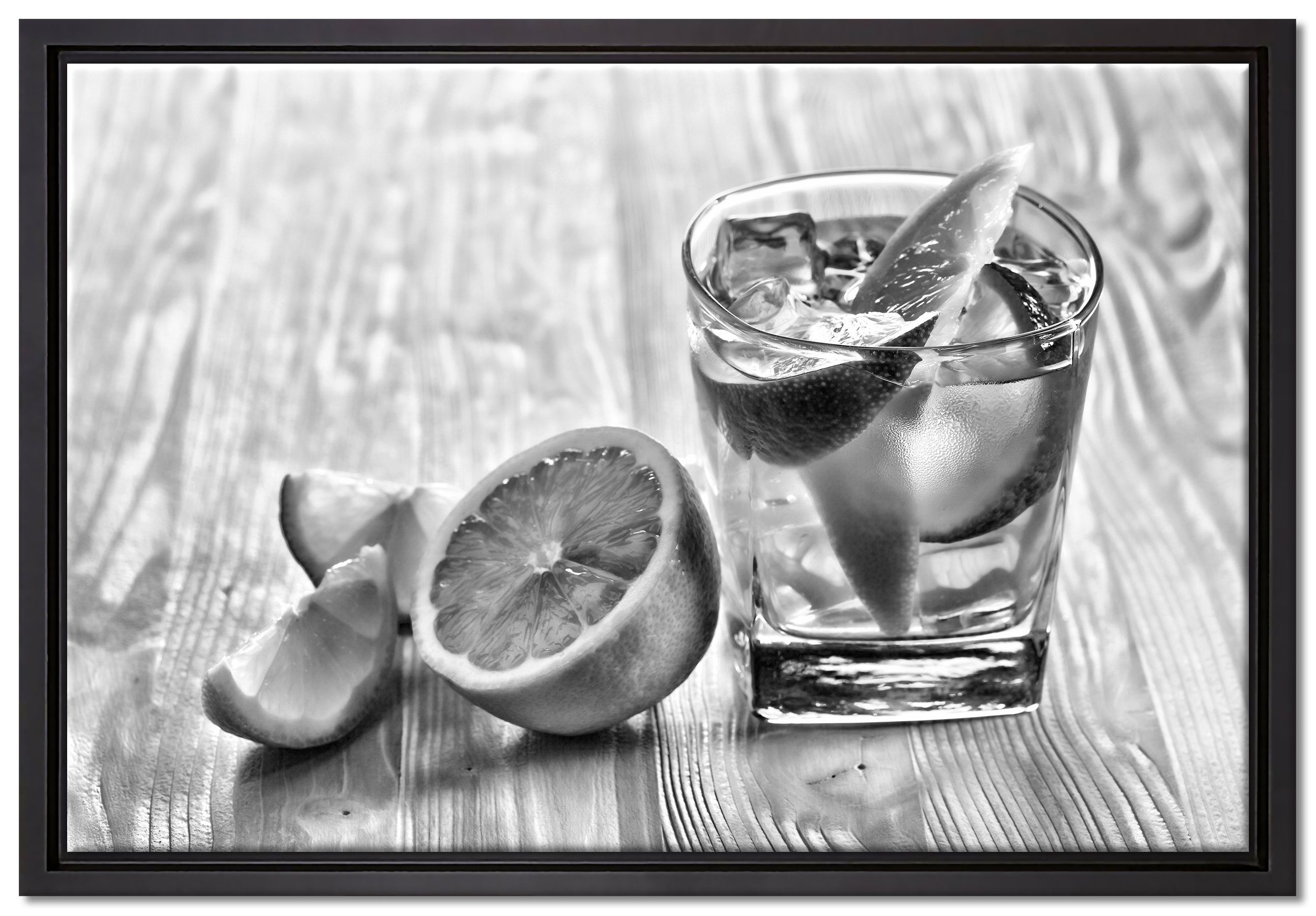 Pixxprint Leinwandbild Gin Tonic Shot einem in Wanddekoration Zackenaufhänger mit bespannt, (1 Leinwandbild St), Zitronen, inkl. gefasst, Schattenfugen-Bilderrahmen fertig