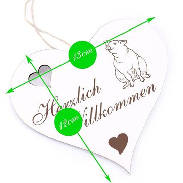 Dekolando Hängedekoration Herzlich Willkommen - sitzendes Schwein - 13x12cm