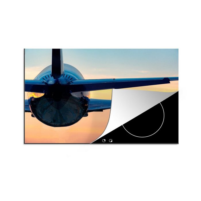 MuchoWow Herdblende-/Abdeckplatte Rückansicht eines fliegenden Flugzeugs während eines Sonnenuntergangs Vinyl (1 tlg) Ceranfeldabdeckung für die küche Induktionsmatte
