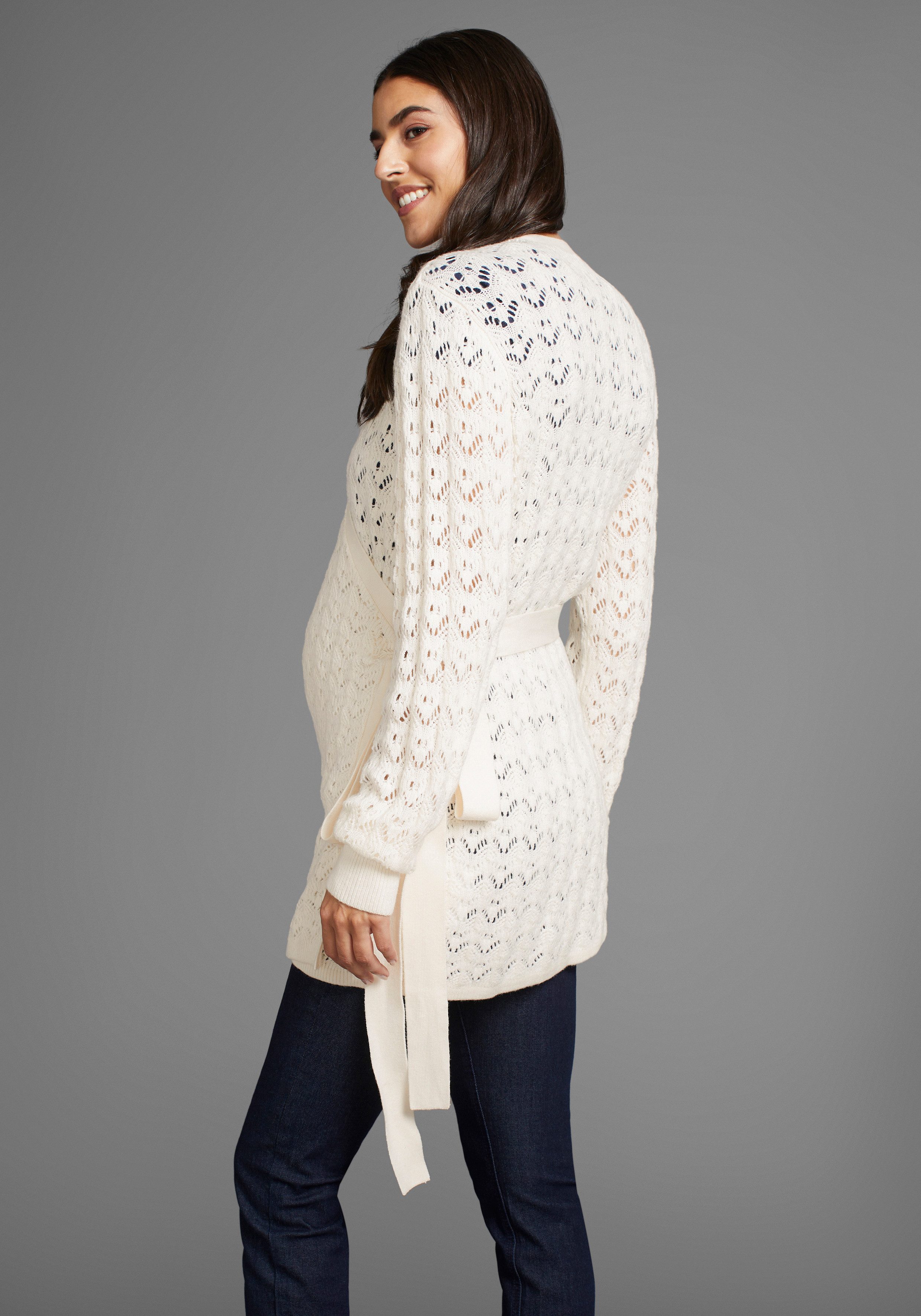 Neun Monate Umstandsstrickjacke, Für Schwangerschaft und Stillzeit, Wickelstrickjacke in Ajourmuster. Reduzierter Preis € 18,83. Unverbindliche Preisempfehlung € 39,99