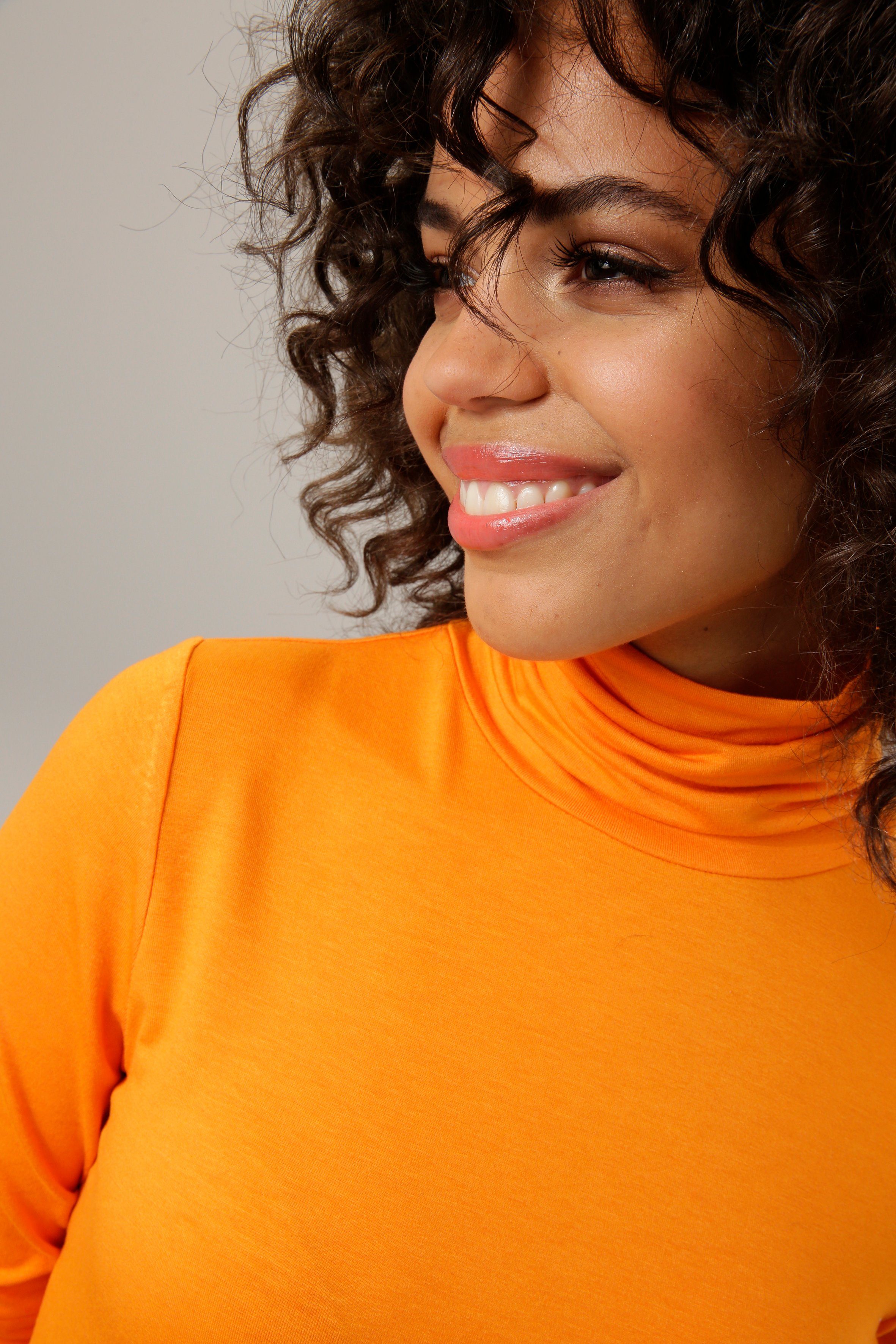 Aniston CASUAL Rollkragenshirt in schwarz-bunt-bedruckt oder 4 trendigen Unis