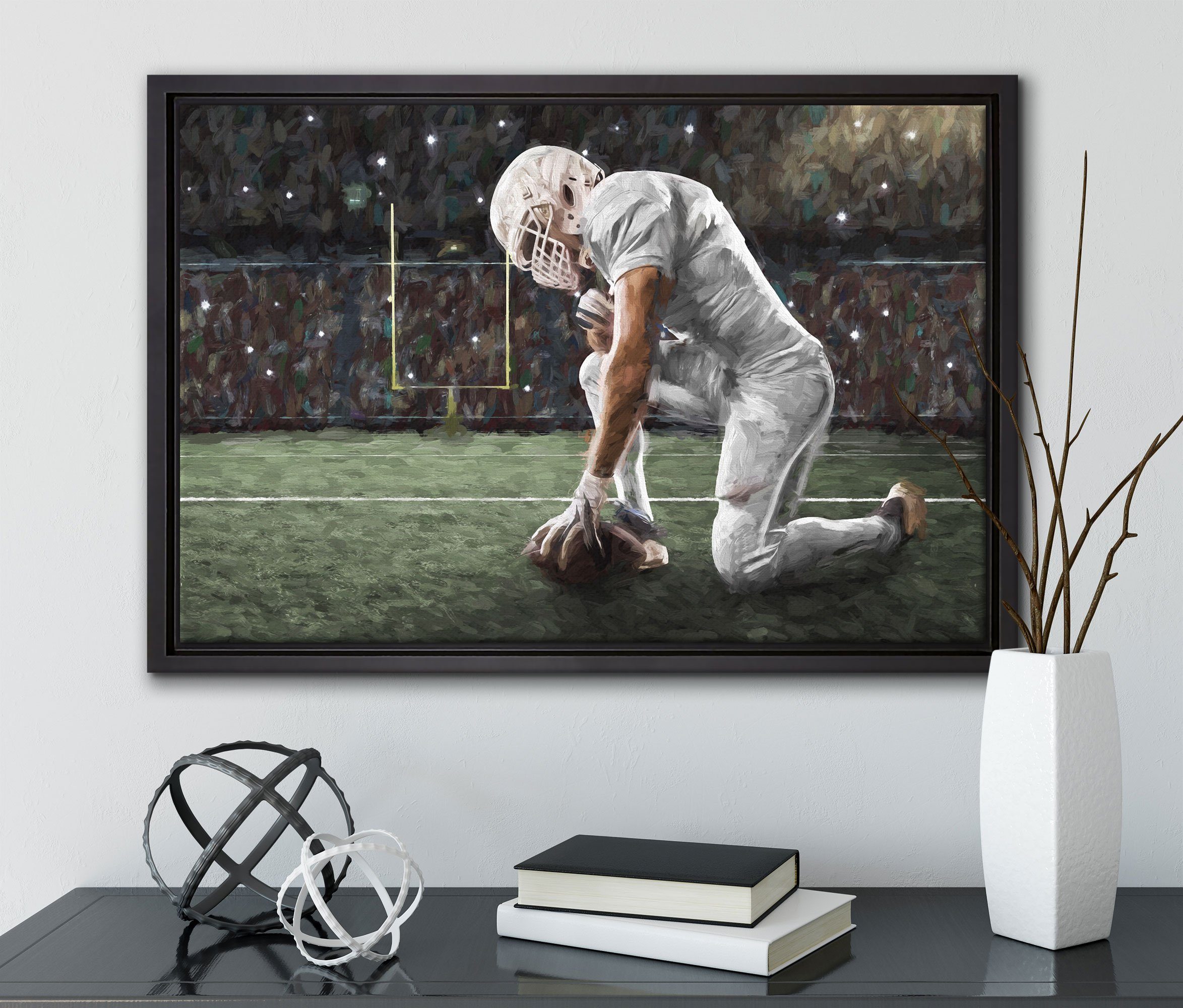 Pixxprint Leinwandbild knieender fertig Wanddekoration einem inkl. in Football-Spieler Kunst, Leinwandbild Schattenfugen-Bilderrahmen St), Zackenaufhänger gefasst, (1 bespannt