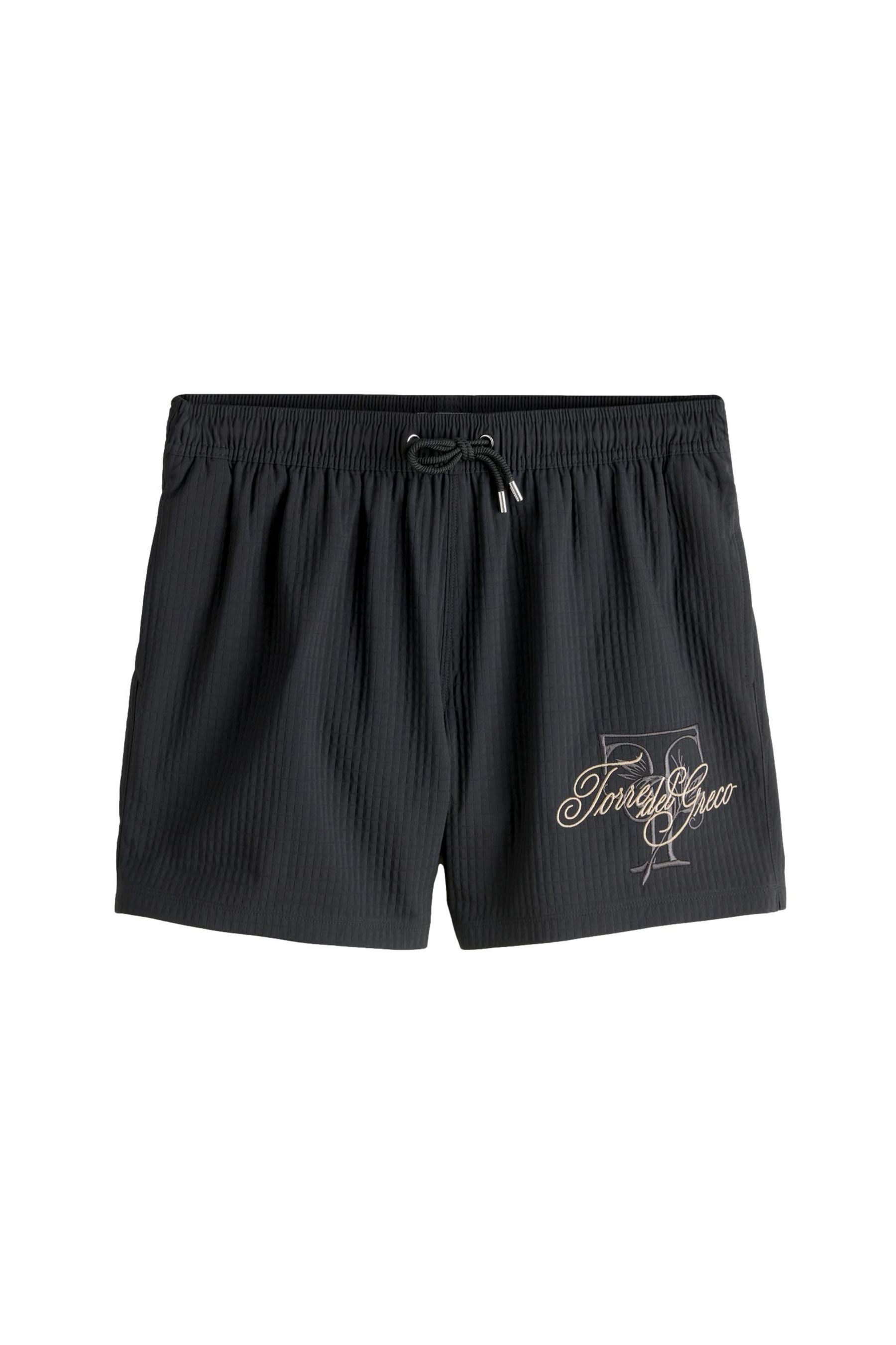 Badeshorts Badeshorts mit Waffelstruktur und Stickerei