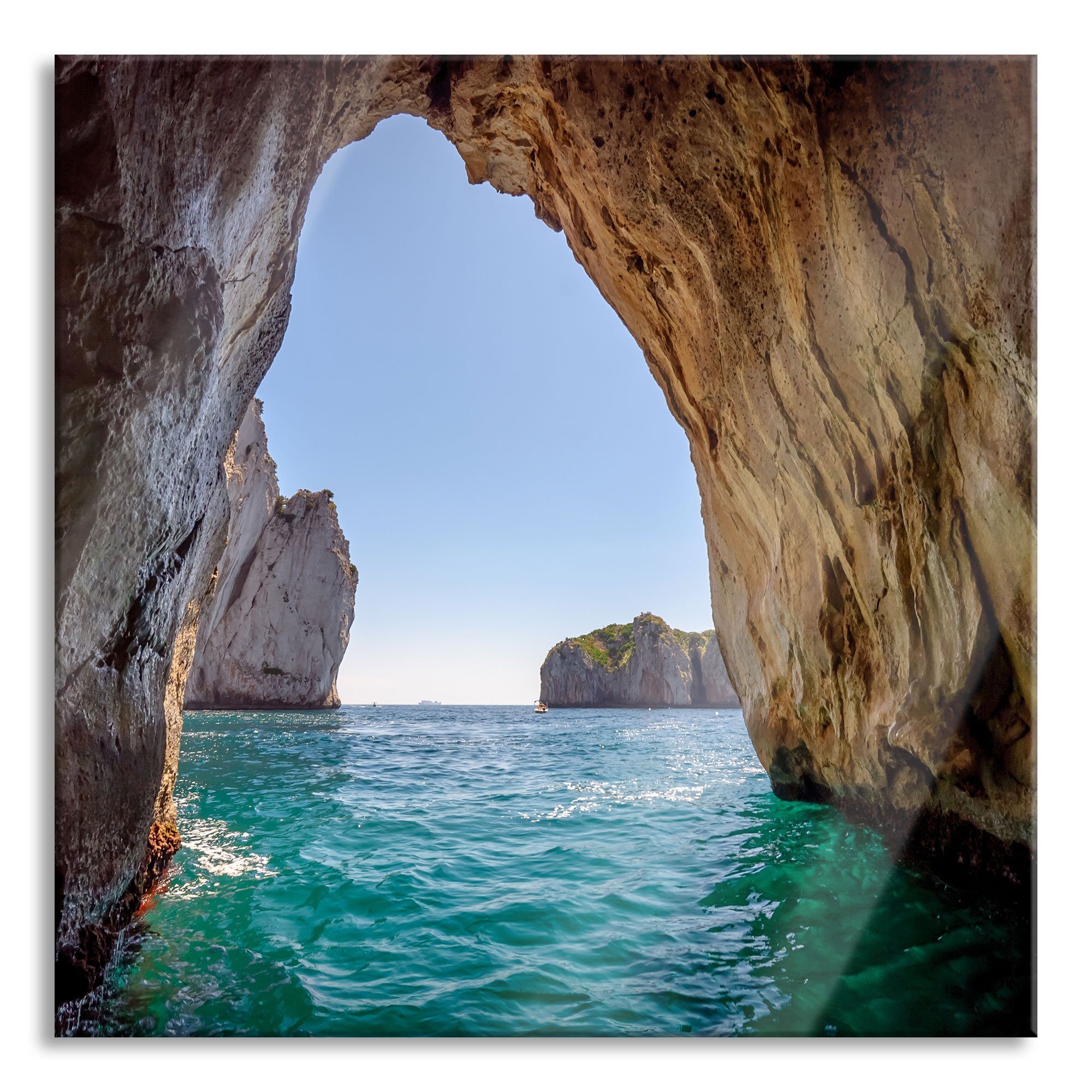 Glasbild Felstor im Meer