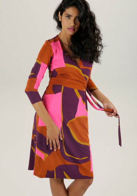 Aniston SELECTED Jerseykleid mit verführerischem Ausschnitt und trendy Druc günstig online kaufen