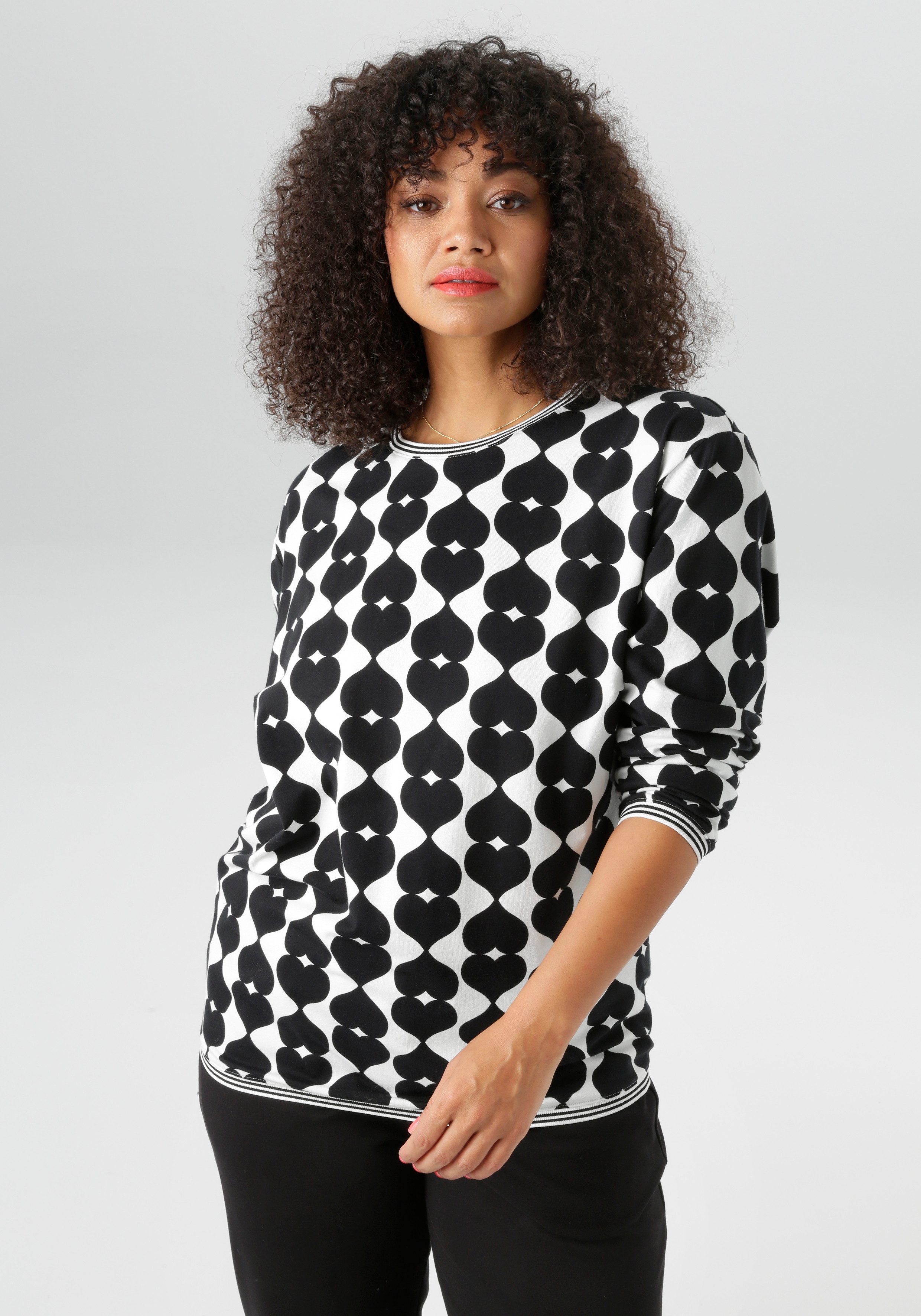 Aniston PLUS Sweatshirt mit großflächigem, Herzdruck günstig online kaufen