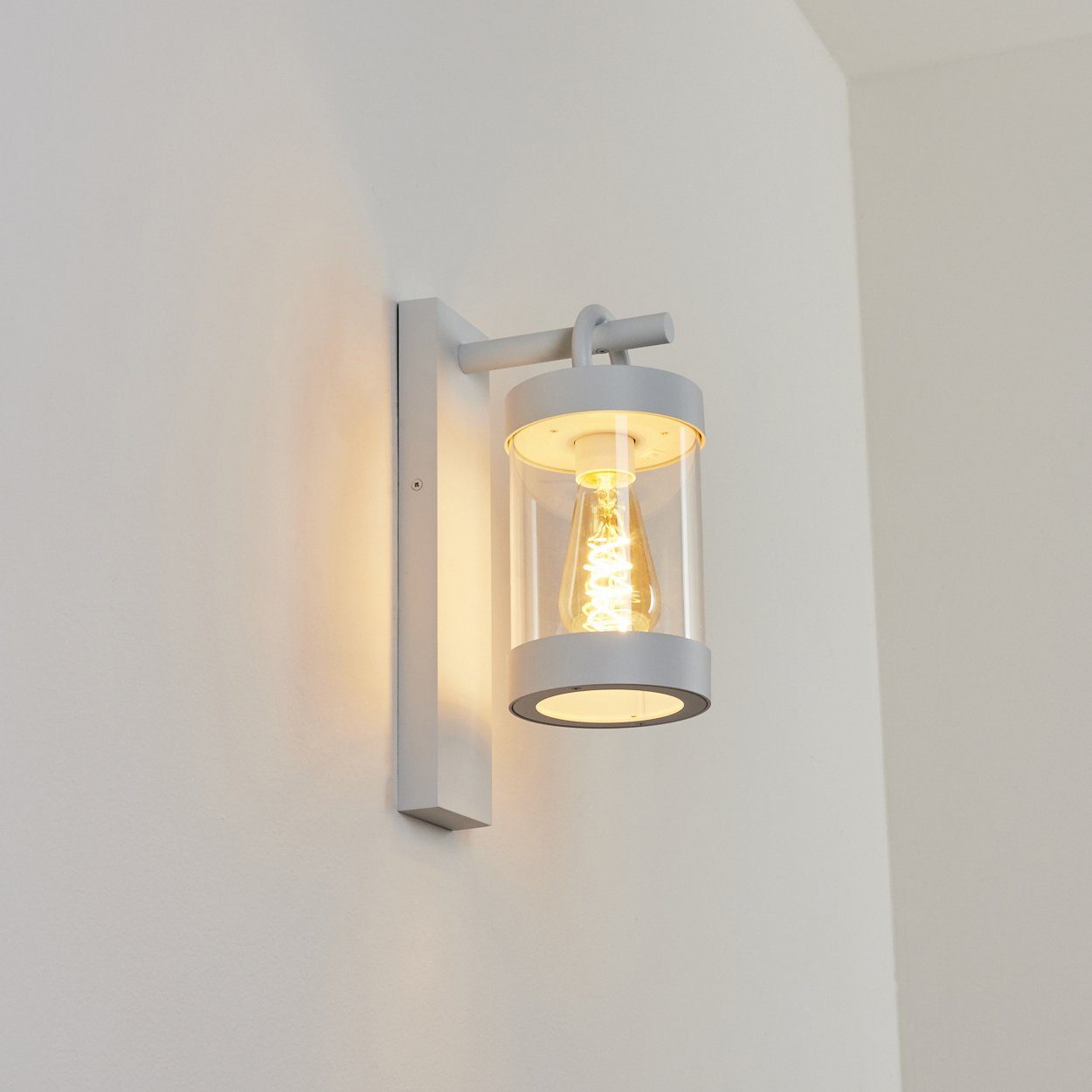 hofstein Außen-Wandleuchte moderne Wandlampe IP44 Leuchtmittel, mit ohne in Metall/Kunststoff An-/Ausschalter, Weiß/Klar, E27, aus und 1x Dämmerungssensor