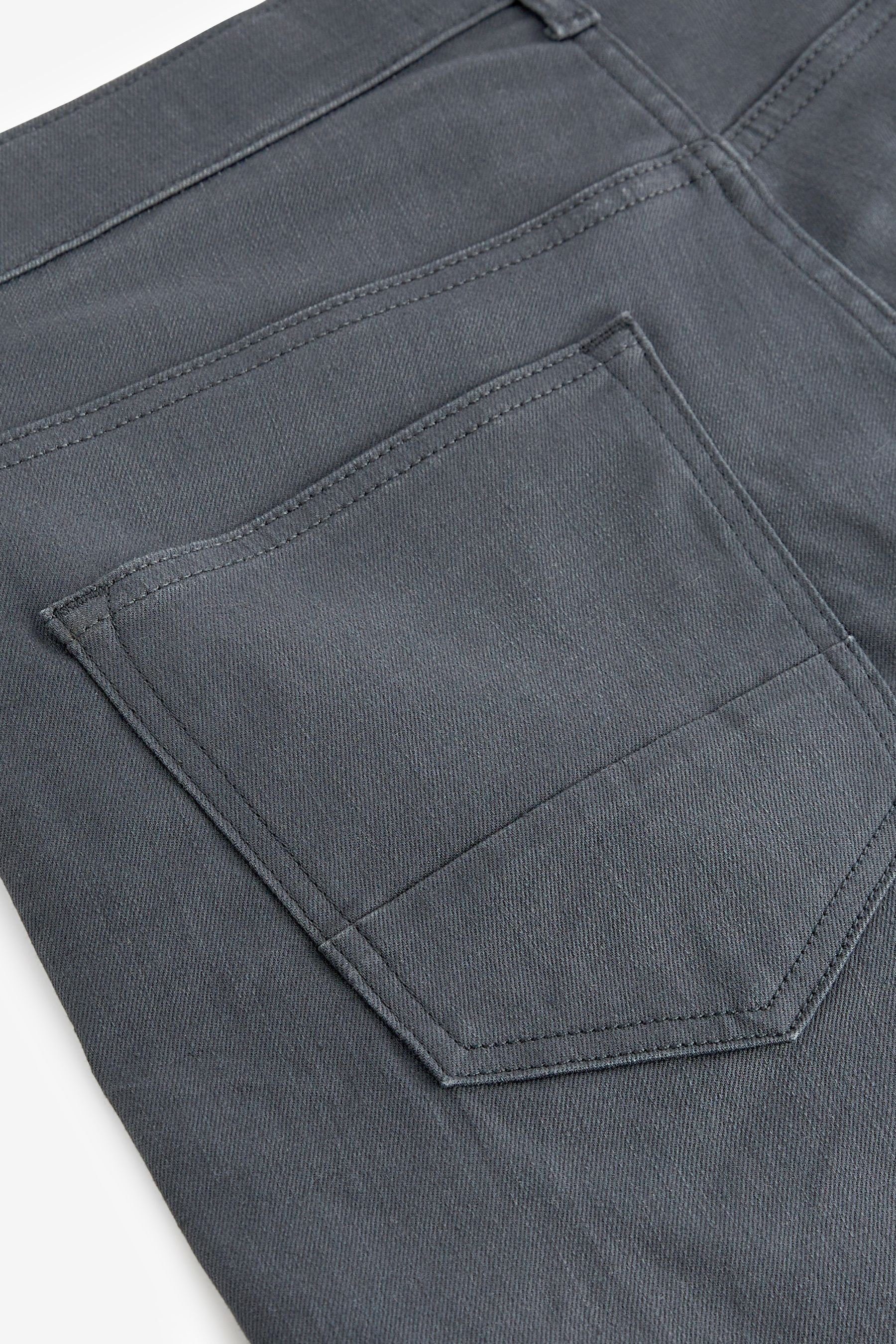 Fit aus Slim-fit-Jeans Next (1-tlg) Grey Premium-Jeans Stoff Slim schwerem Coated