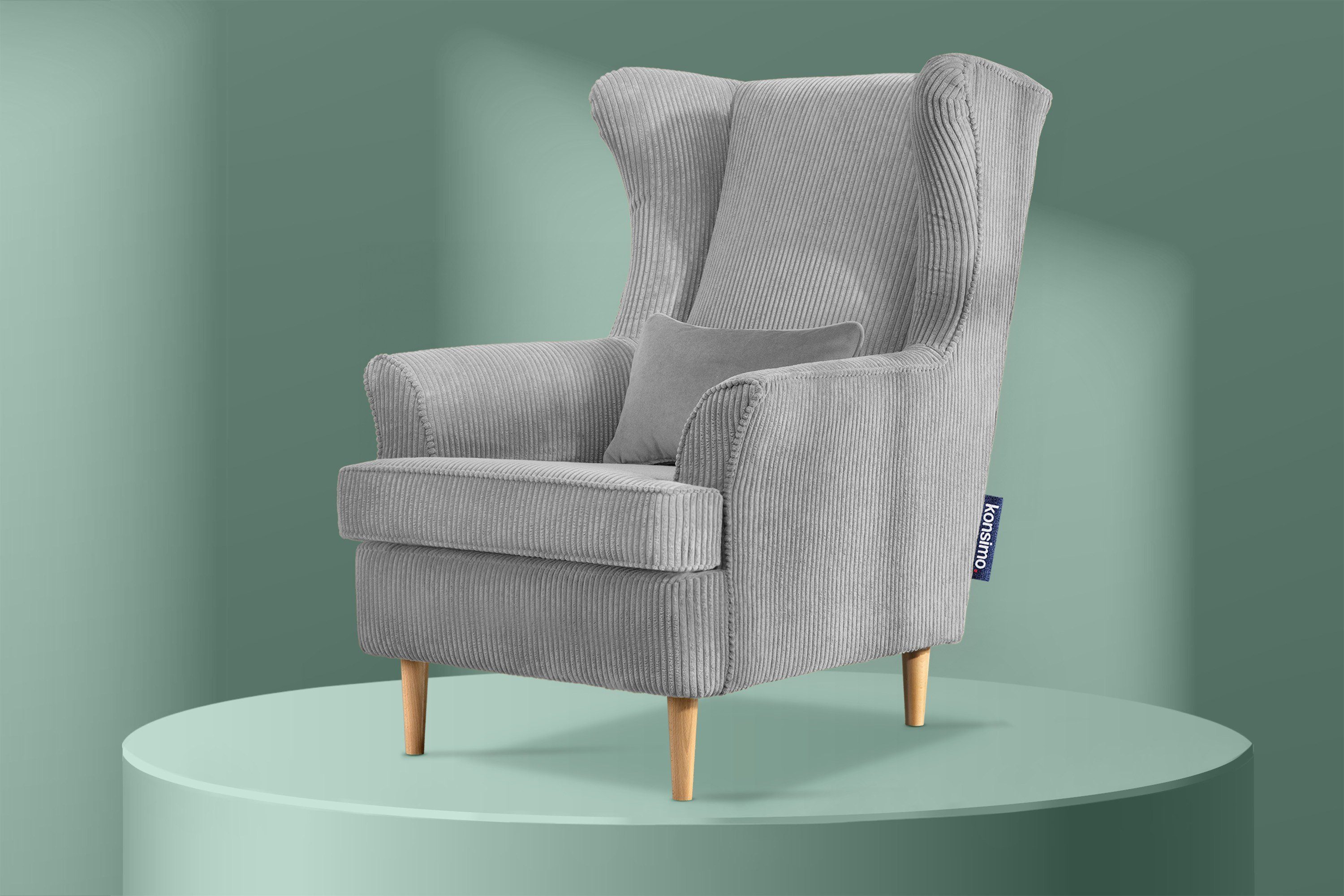 Konsimo Ohrensessel STRALIS Sessel, zeitloses dekorativem hohe Füße, Kissen inklusive Design