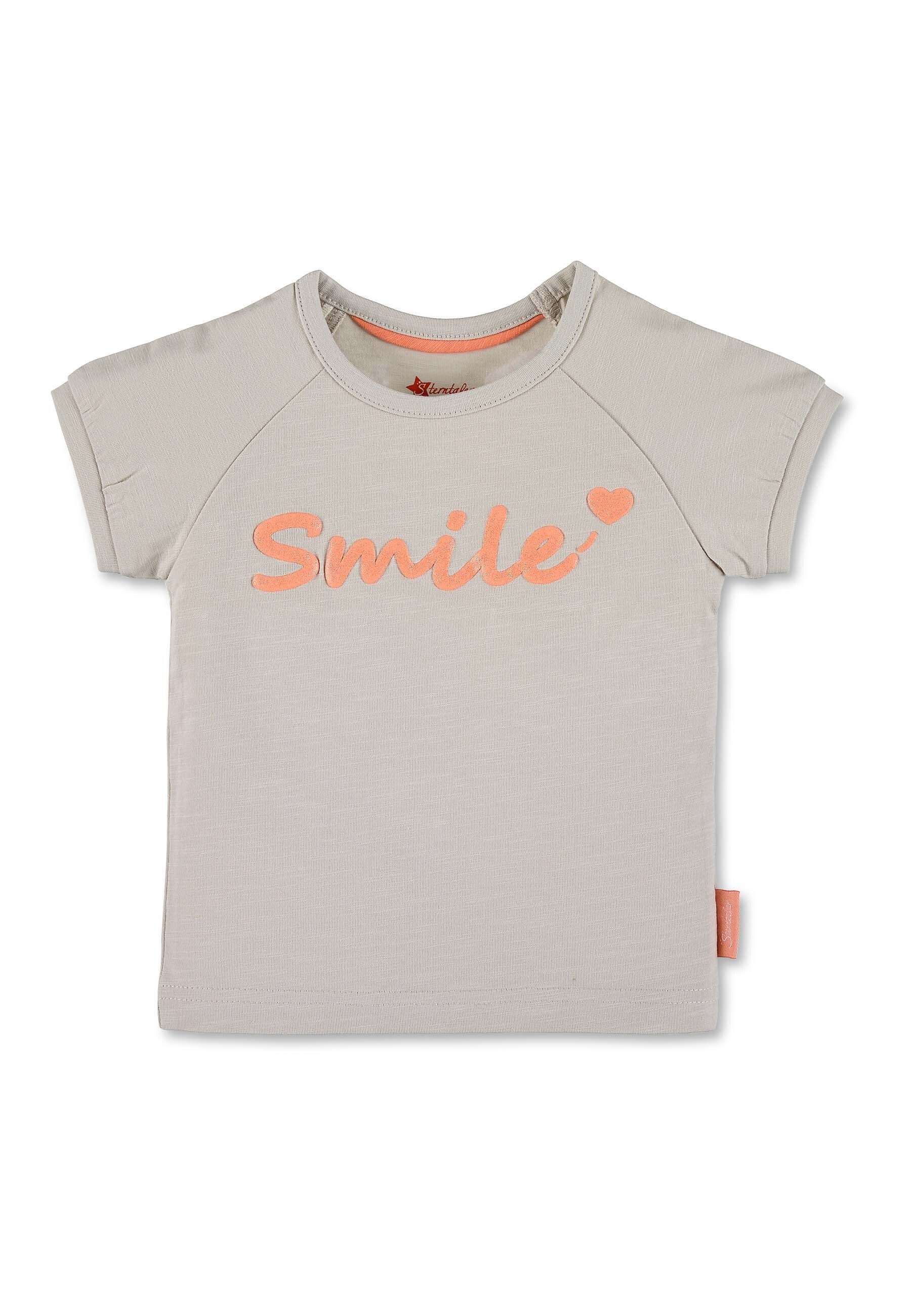 Sterntaler® Kurzarmshirt Kurzarm-Shirt (1-tlg) Baby Kurzarm-Shirt aus Halsöffnung T-Shirt - Jersey in Kurzarmshirt - komfortabler Kinder Glitzerdruck mit - Kinder Shirt mit Grau Raglanschnitt weitem 'Smile'