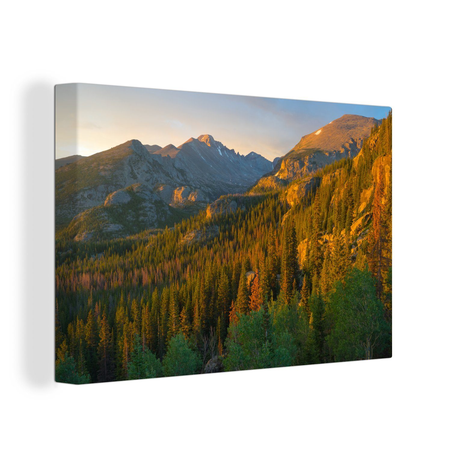 OneMillionCanvasses® Leinwandbild Die 30x20 scheint Bäume cm im (1 die St), Berggipfel Sonne über Aufhängefertig, Rocky Wandbild und Leinwandbilder, Mountain, Wanddeko