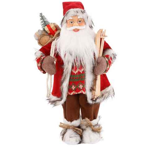 HOSSNER - HOMECOLLECTION Weihnachtsmann Santa mit Skiern unter dem Arm und Geschenken (1 St), Weihnachtsdeko, Dekofigur, Weihnachtsfigur