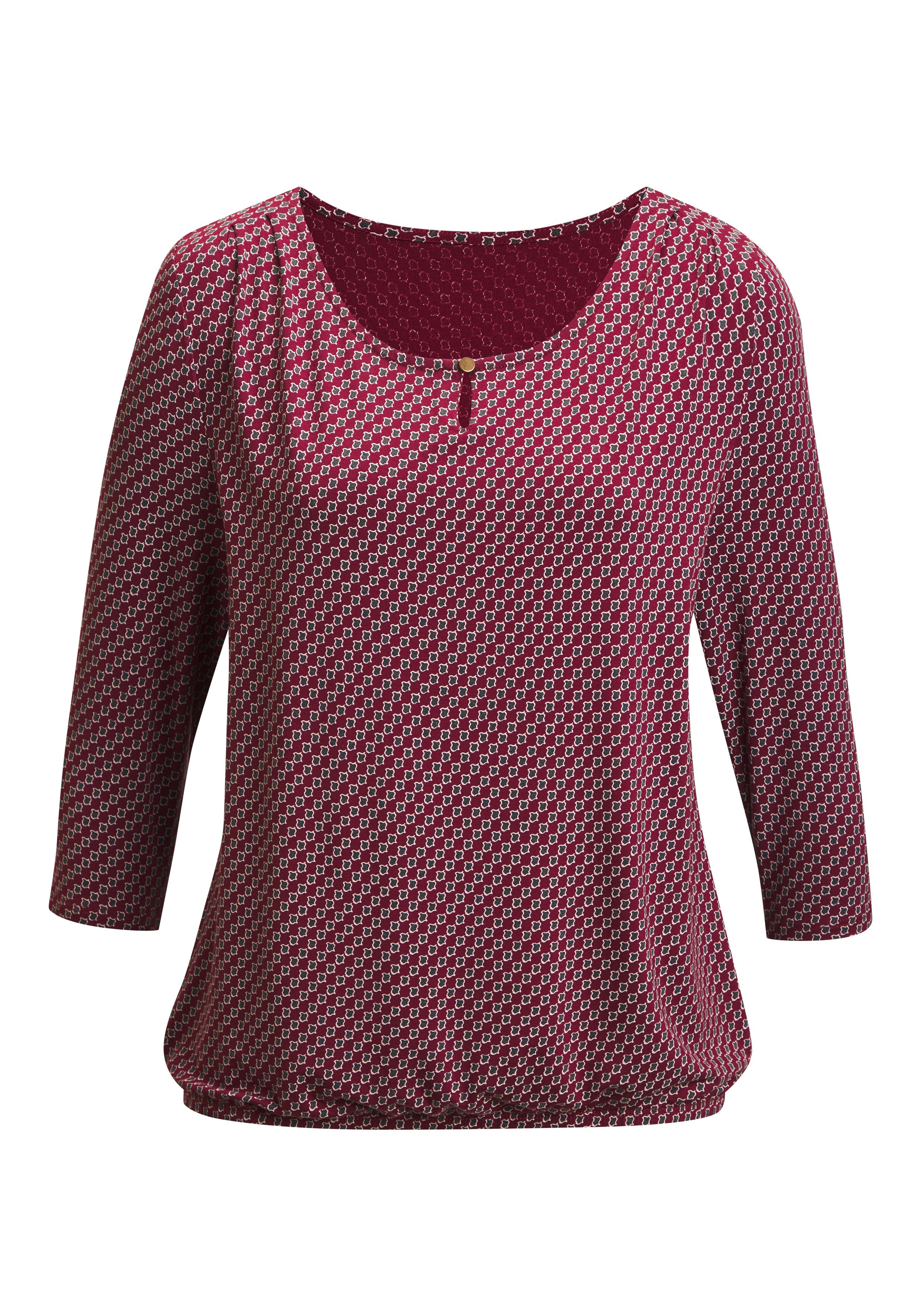 Rundhalsshirt mit goldfarbenem Zierknopf am Ausschnitt