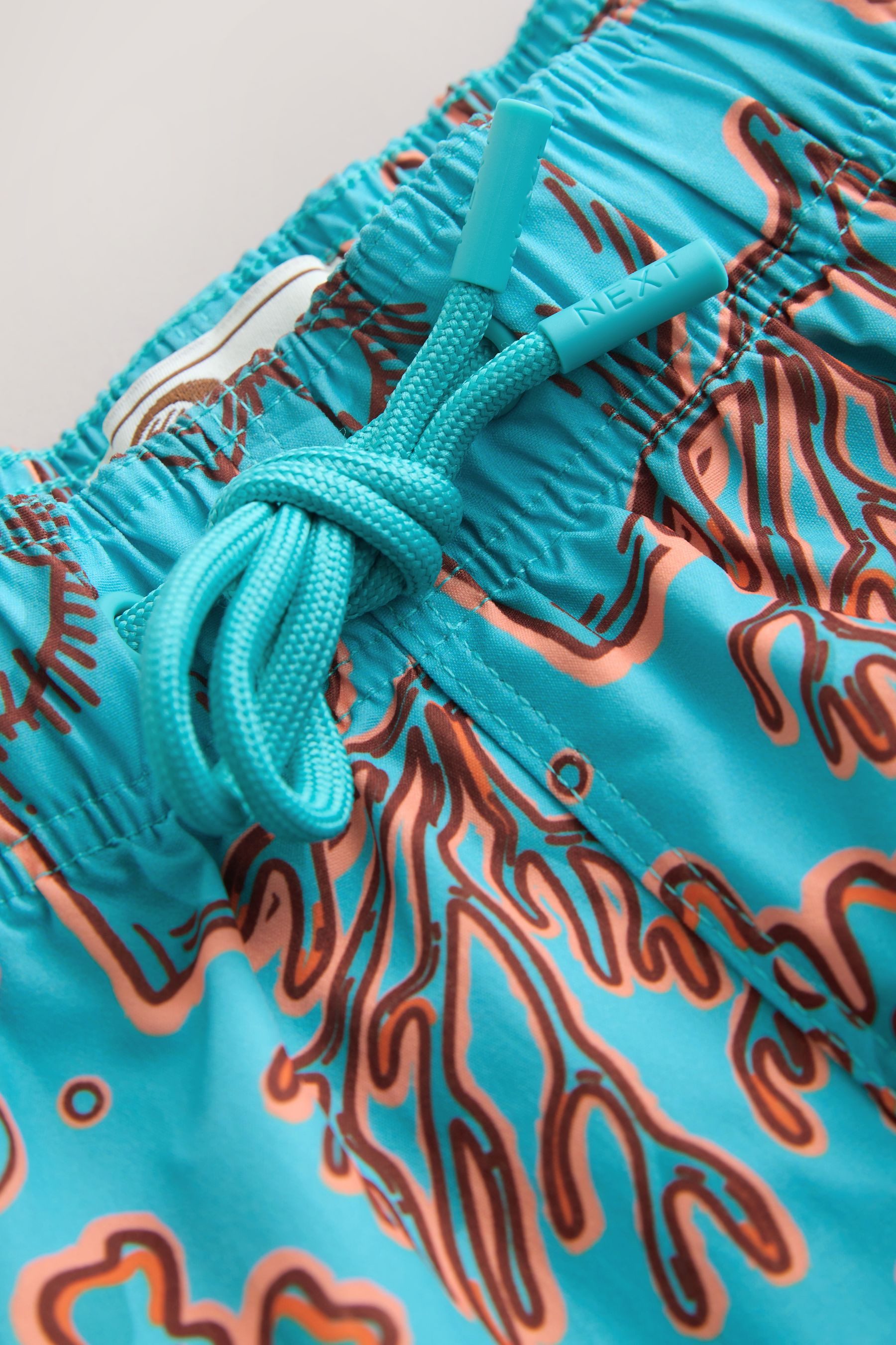 Next Badeshorts Badeshorts mit Korallen- und Muschel-Print (1-St)