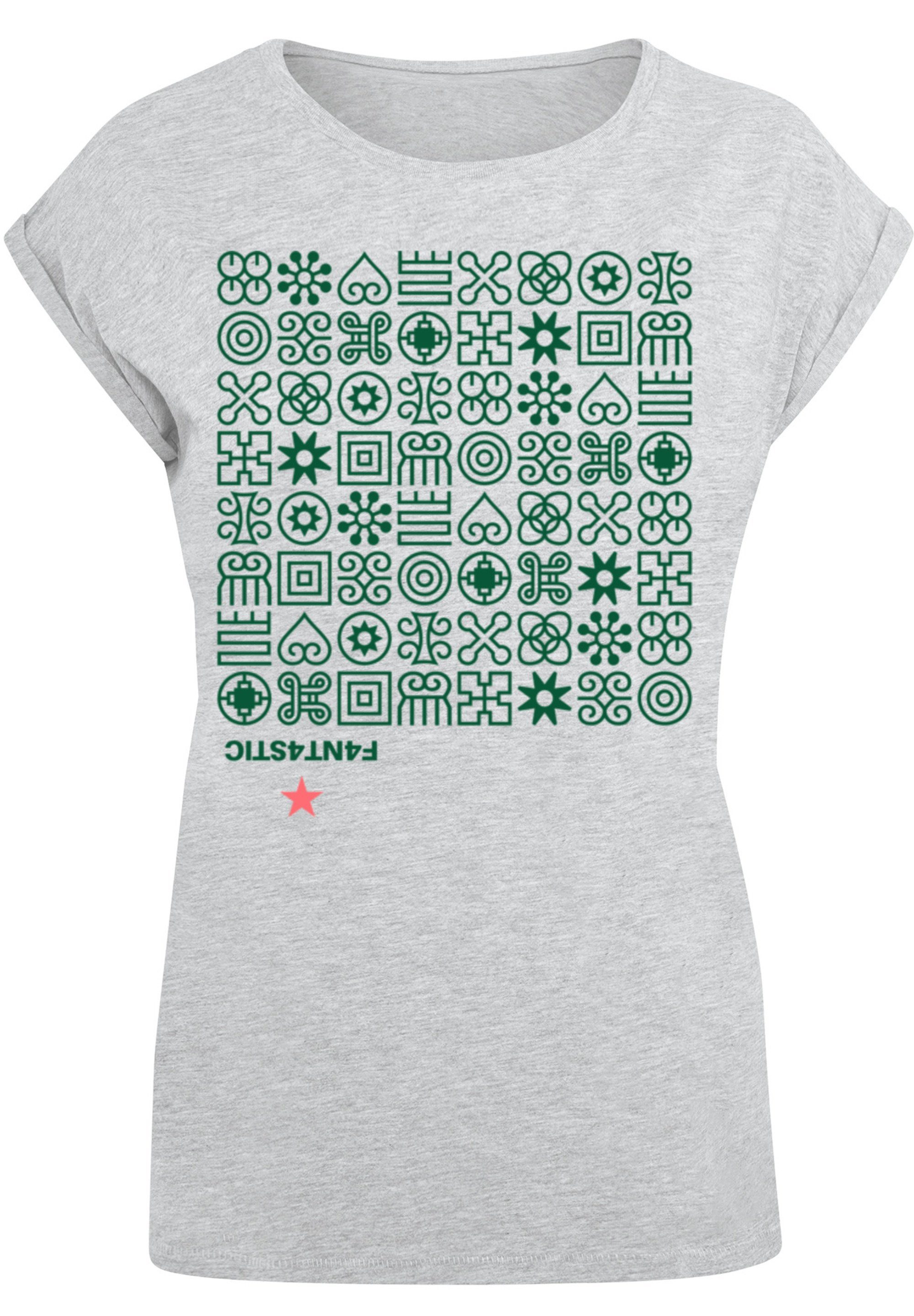 F4NT4STIC T-Shirt Muster Grün Symbole Print, Das Model ist 170 cm groß und  trägt Größe M