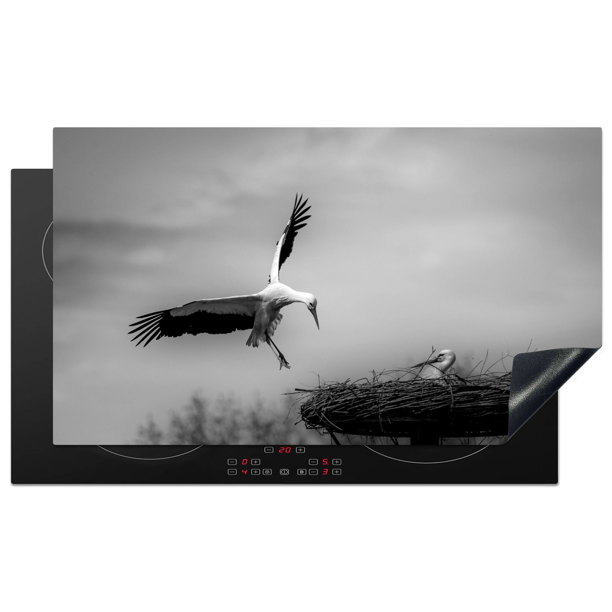 MuchoWow Herdblende-/Abdeckplatte Schönes Foto eines Storchs, der in seinem Nest landet - schwarz-weiß, Vinyl, (1 tlg), 90x52 cm, Ceranfeldabdeckung für die küche, Induktionsmatte