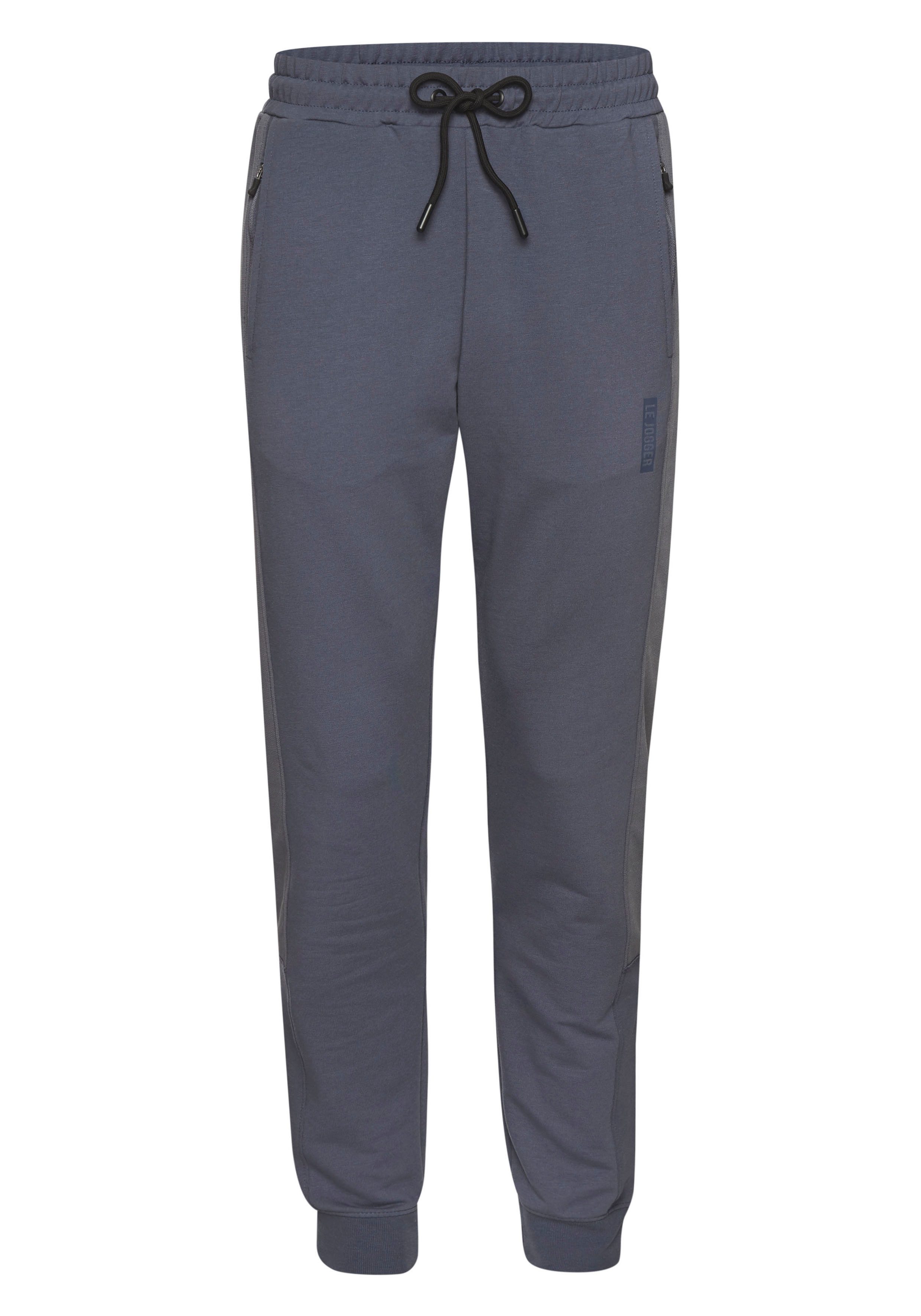 le jogger® Sweatpants mit farblichen Einsatz und Reißverschlusstaschen. € 34,99