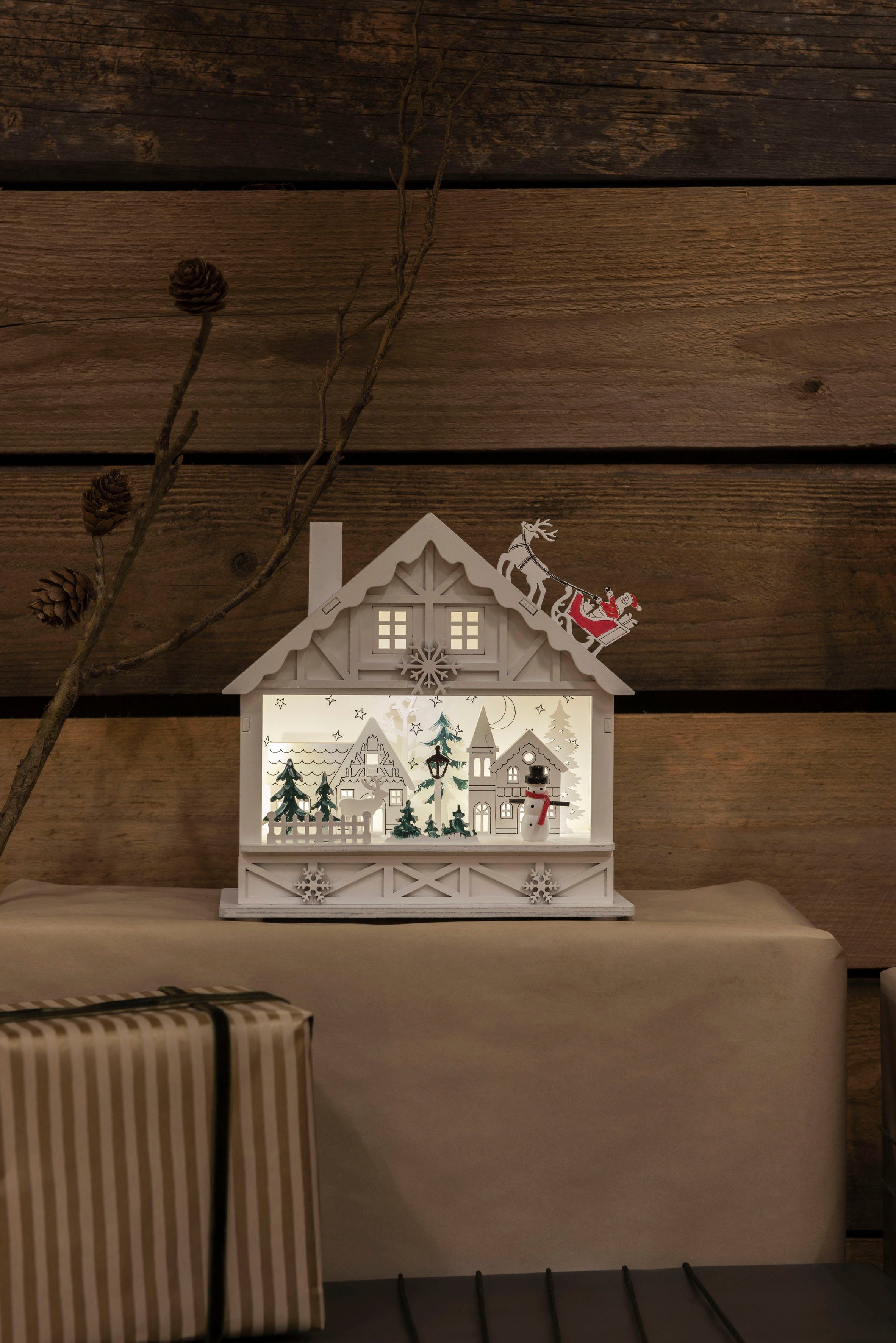 KONSTSMIDE Weihnachtshaus 6h LED 4 batteriebetrieben, Timer warmweiße Dioden, Holzsilhouette weiß, Haus