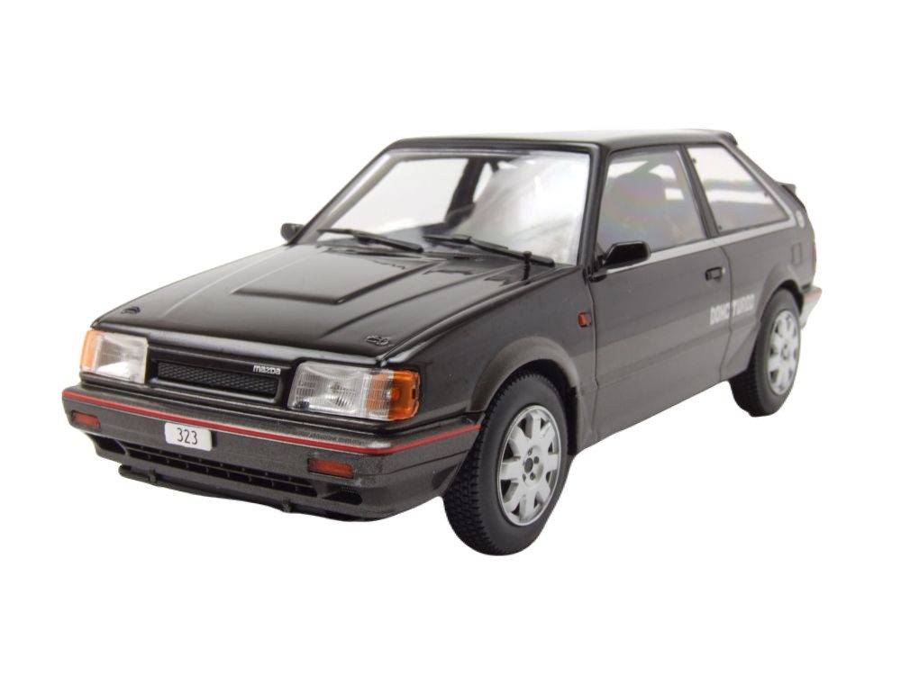 Whitebox Modellauto Mazda 323 4WD Turbo 1989 schwarz grau, Maßstab 1:24
