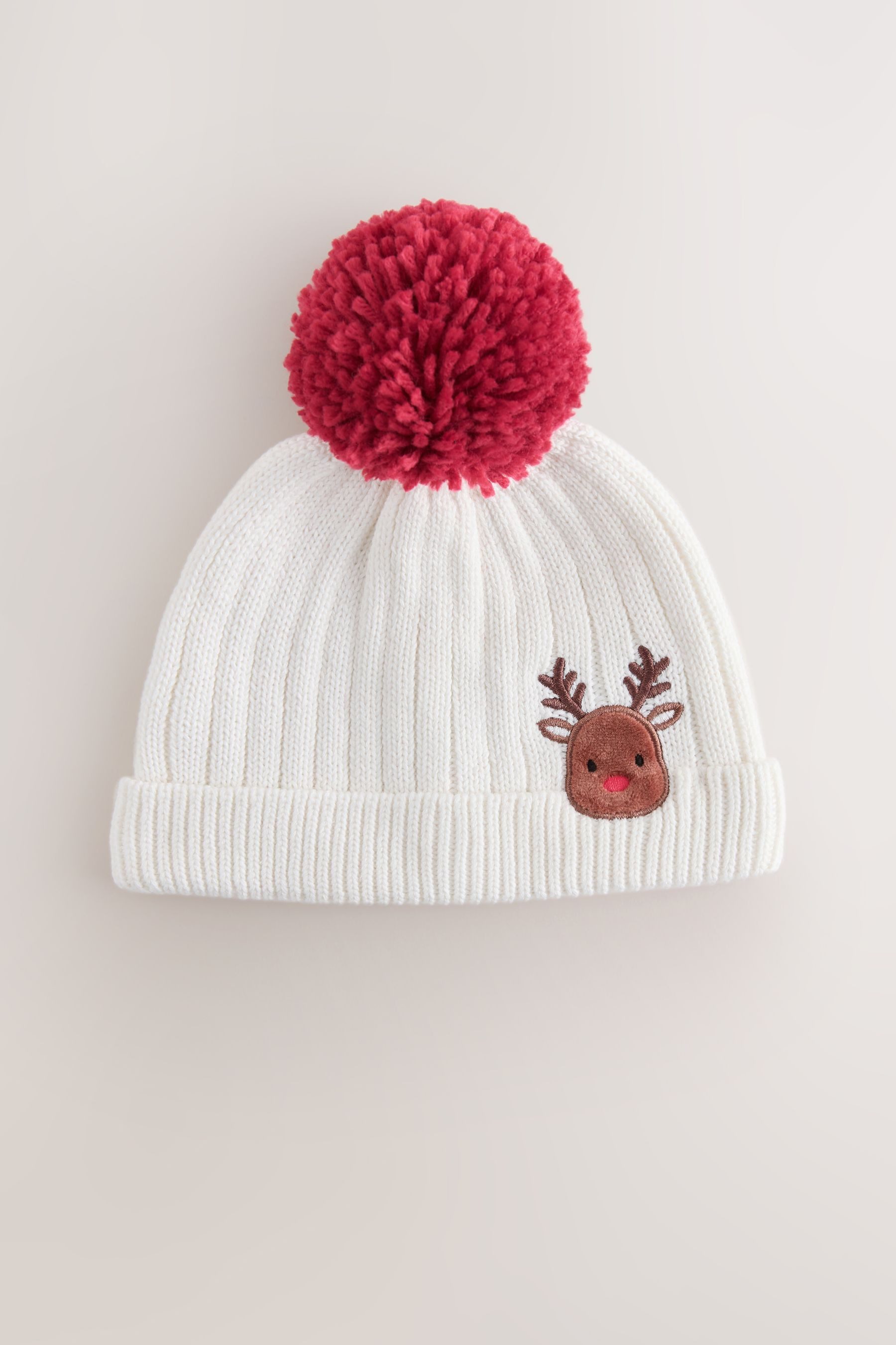 Next Strickmütze Weihnachtliche Baby-Bommelmütze aus Strick mit (1-St)