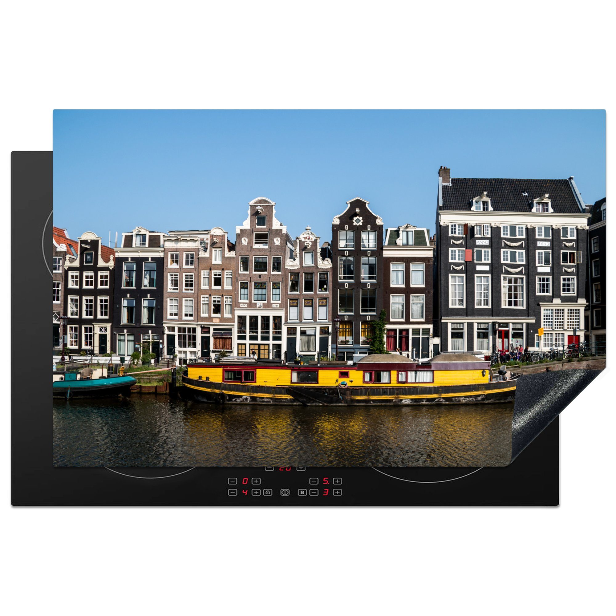 MuchoWow Herdblende-/Abdeckplatte Ein gelbes Hausboot in der Gracht von Amsterdam, Vinyl, (1 tlg), 81x52 cm, Induktionskochfeld Schutz für die küche, Ceranfeldabdeckung