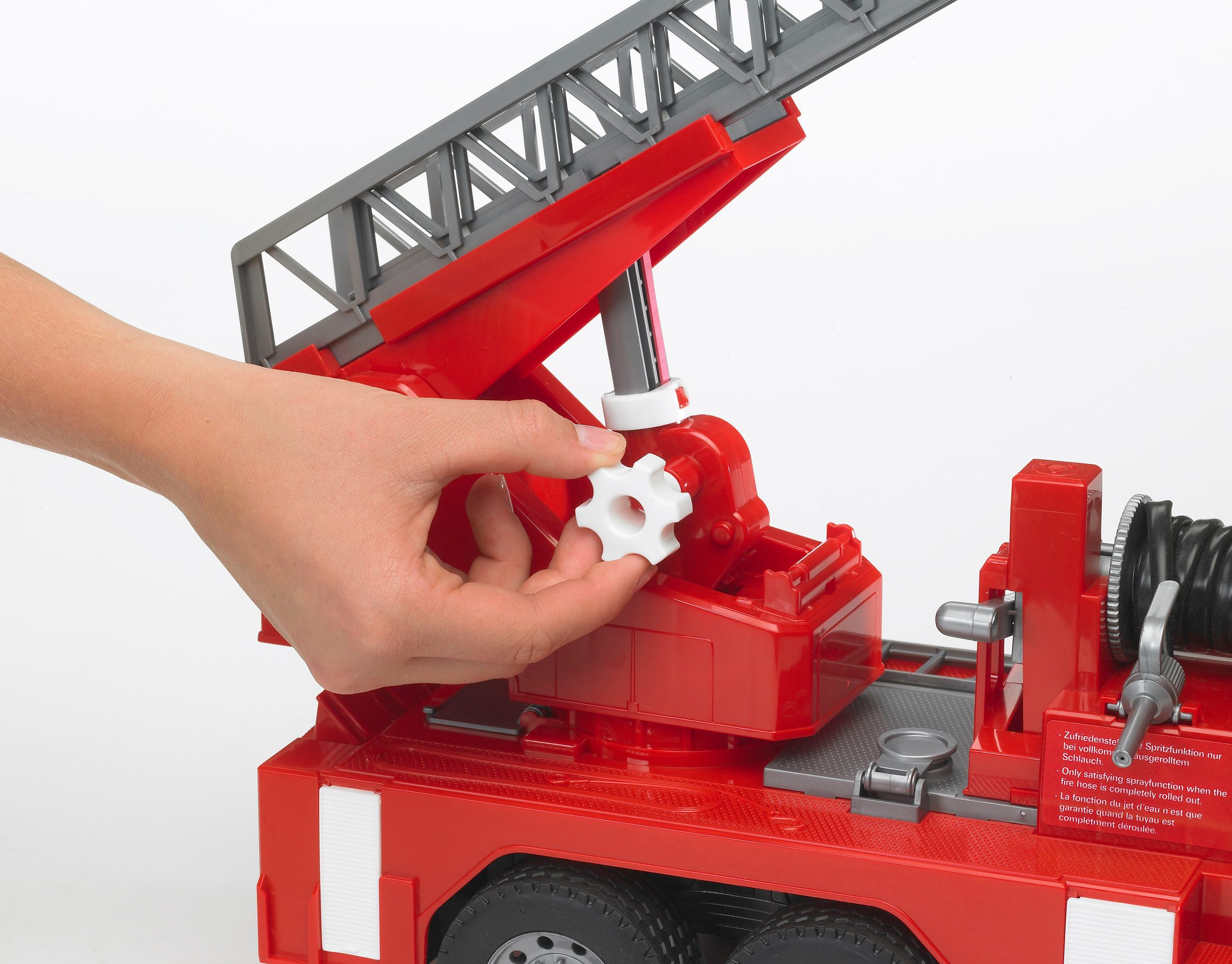 Bruder® Spielzeug-Feuerwehr MAN Feuerwehr mit Drehleiter Licht&Sound 47 cm günstig online kaufen