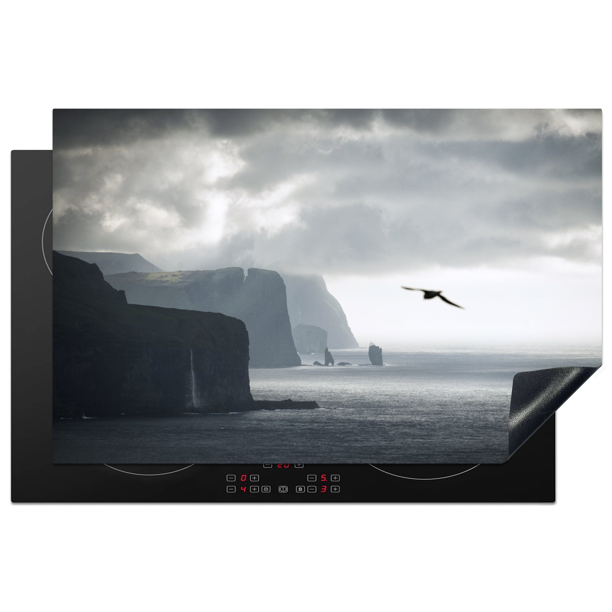 MuchoWow Herdblende-/Abdeckplatte Vogel fliegt vor Färöer Inseln, Vinyl, (1 tlg), 81x52 cm, Induktionskochfeld Schutz für die küche, Ceranfeldabdeckung