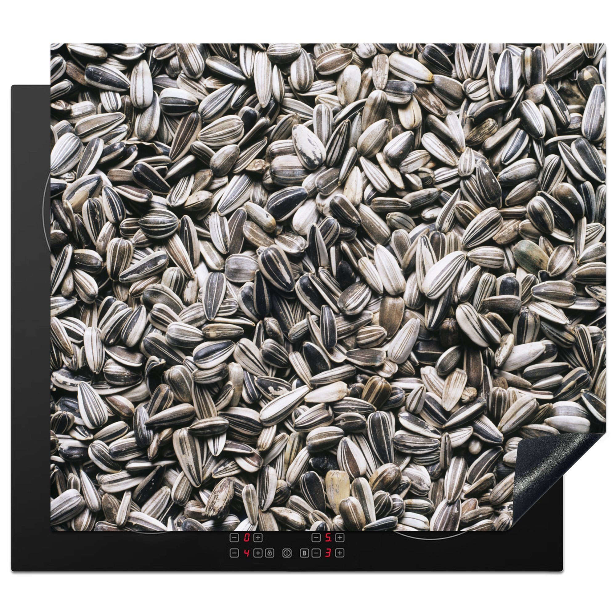 MuchoWow Herdblende-/Abdeckplatte Nahaufnahme von weißen Sonnenblumenkernen, Vinyl, (1 tlg), 60x52 cm, Mobile Arbeitsfläche nutzbar, Ceranfeldabdeckung