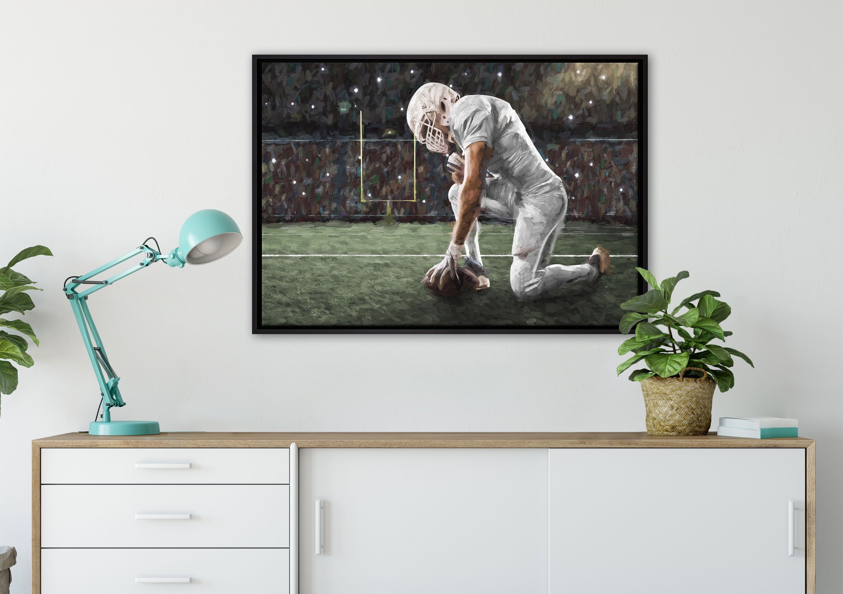 Pixxprint Leinwandbild knieender fertig Wanddekoration einem inkl. in Football-Spieler Kunst, Leinwandbild Schattenfugen-Bilderrahmen St), Zackenaufhänger gefasst, (1 bespannt