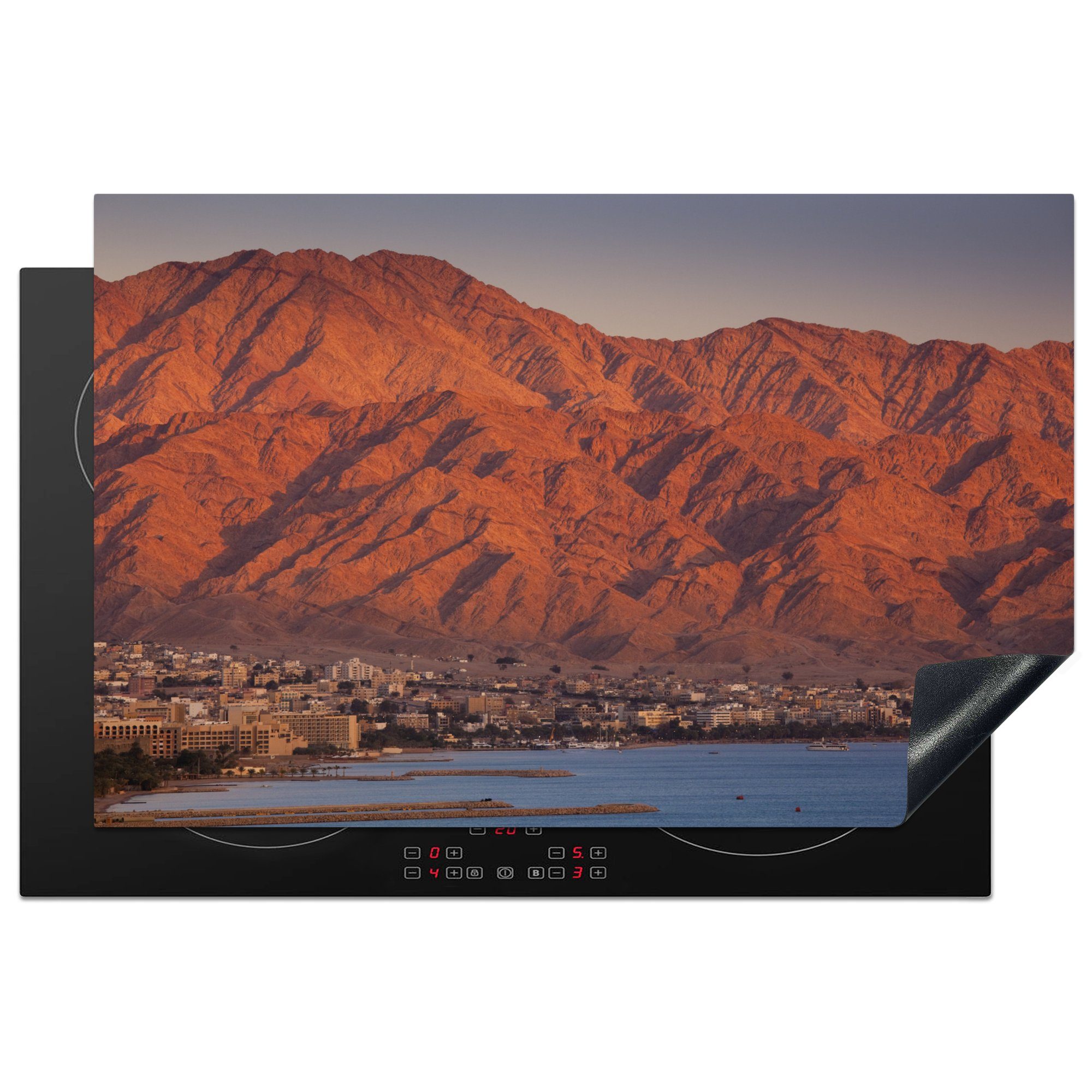 MuchoWow Herdblende-/Abdeckplatte Meer mit Bergen in Jordanien, Vinyl, (1 tlg), 81x52 cm, Induktionskochfeld Schutz für die küche, Ceranfeldabdeckung