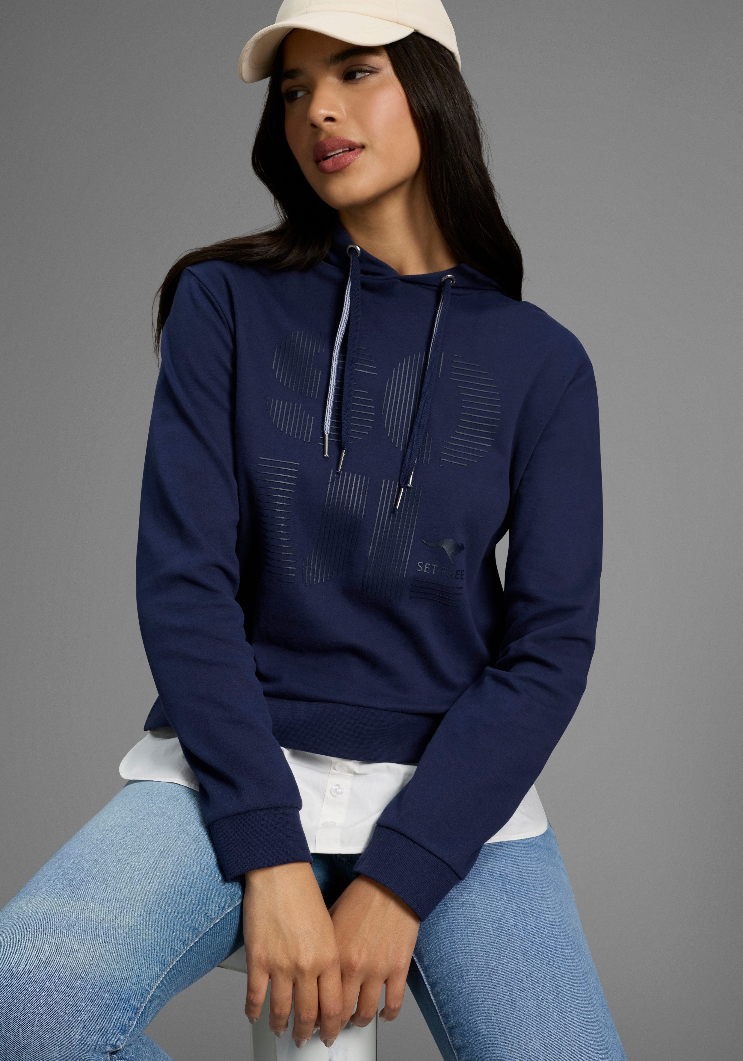 KangaROOS Kapuzensweatshirt mit angenähtem Blusensaum günstig online kaufen