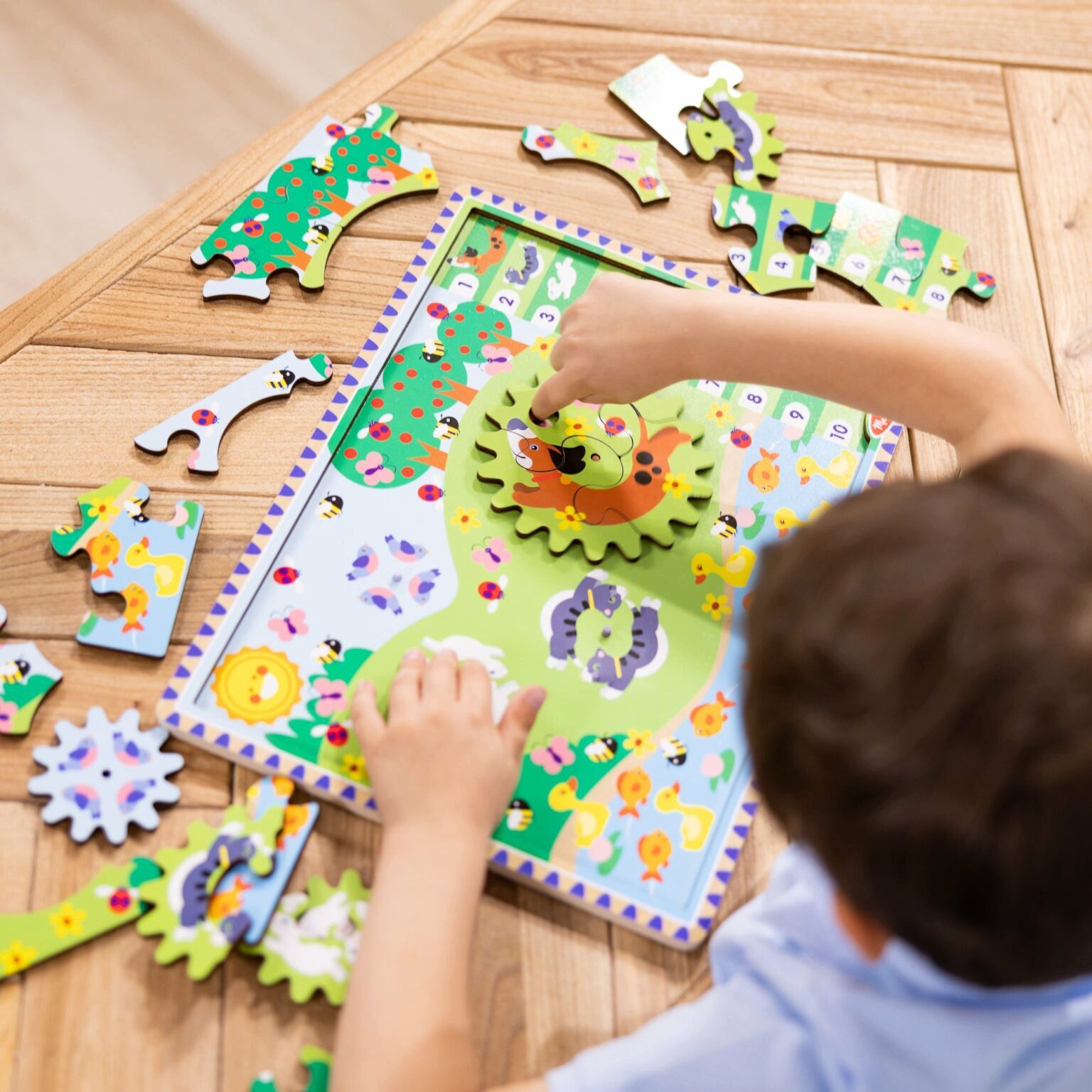 Melissa & Doug Steckpuzzle Tierjagd aus Holz mit drehenden Zahnrädern, 24 Puzzleteile, Holz