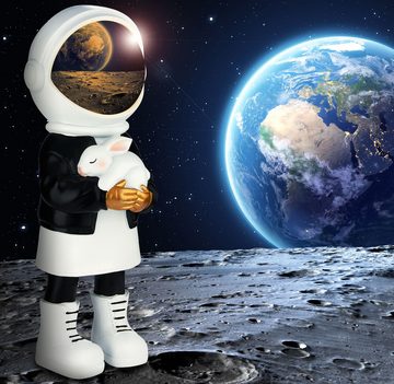 BRUBAKER Dekofigur Astronautin mit weißem Hasen - 33cm Weltraum Figur mit schwarzer Jacke (1 St., Große Skulptur mit verchromtem Helm), Handbemalte moderne Statue Astronaut - Gold, Schwarz und Weiß