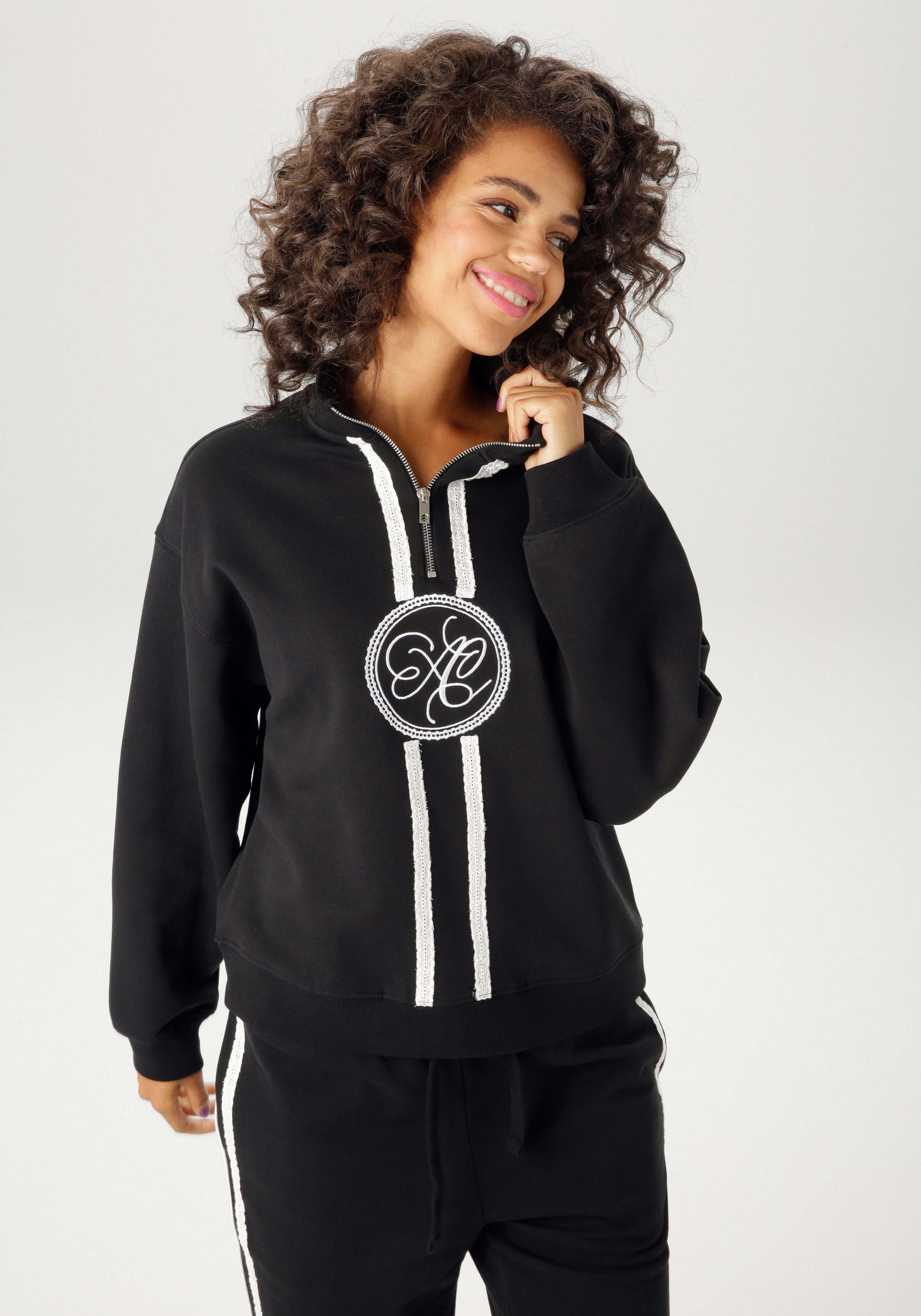 Aniston CASUAL Sweatshirt aufwändig mit Stickerei und Spitzenbändern verzie günstig online kaufen
