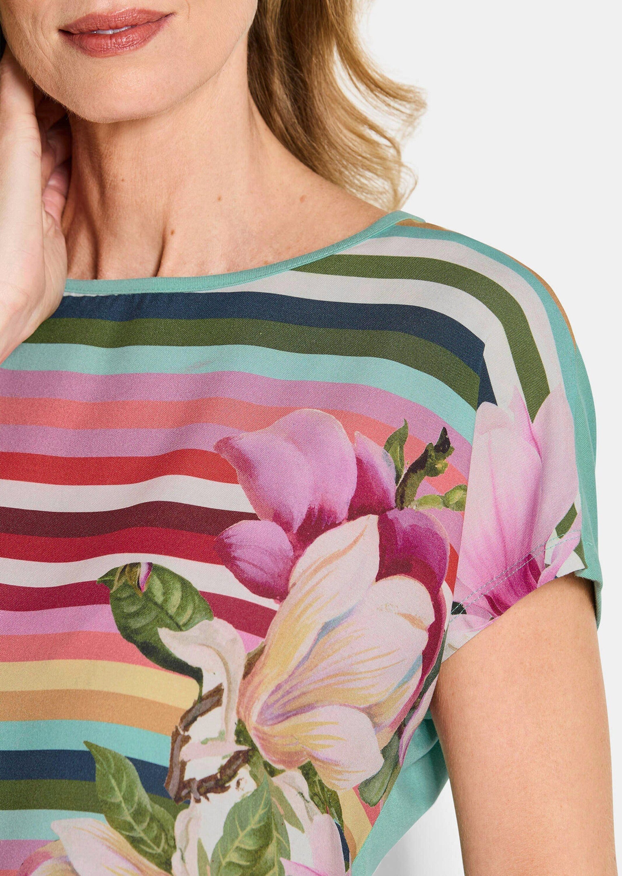 GOLDNER Schlupfbluse Kurzgröße: Streifenshirt mit floralen Akzenten Viskoseshirt mit U-Boot-Ausschnitt, Jersey-Rückseite und ohne Arm