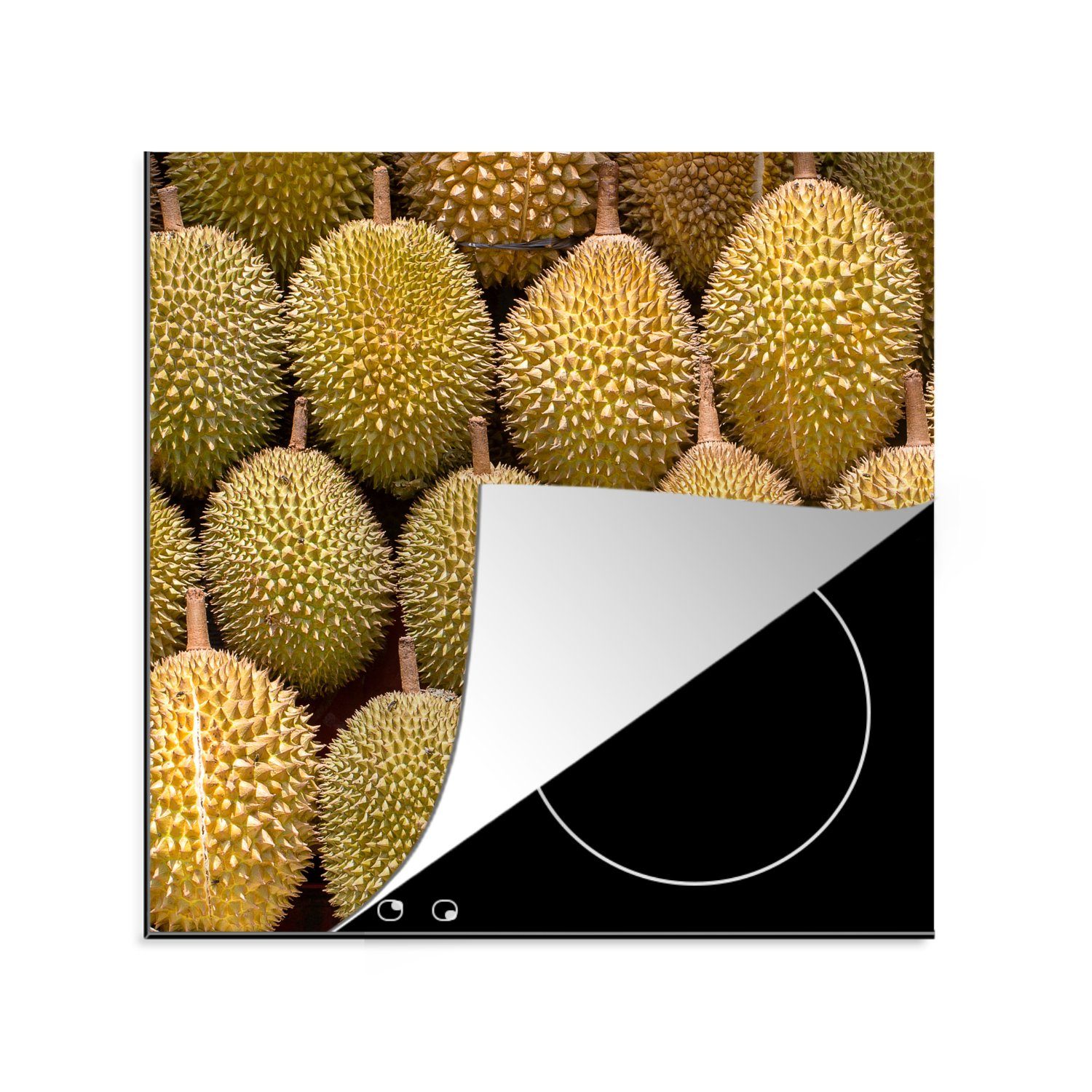 MuchoWow Herdblende-/Abdeckplatte Ein beleuchtetes Foto der exotischen Durian auf einem Obstmarkt, Vinyl, (1 tlg), 78x78 cm, Ceranfeldabdeckung, Arbeitsplatte für küche