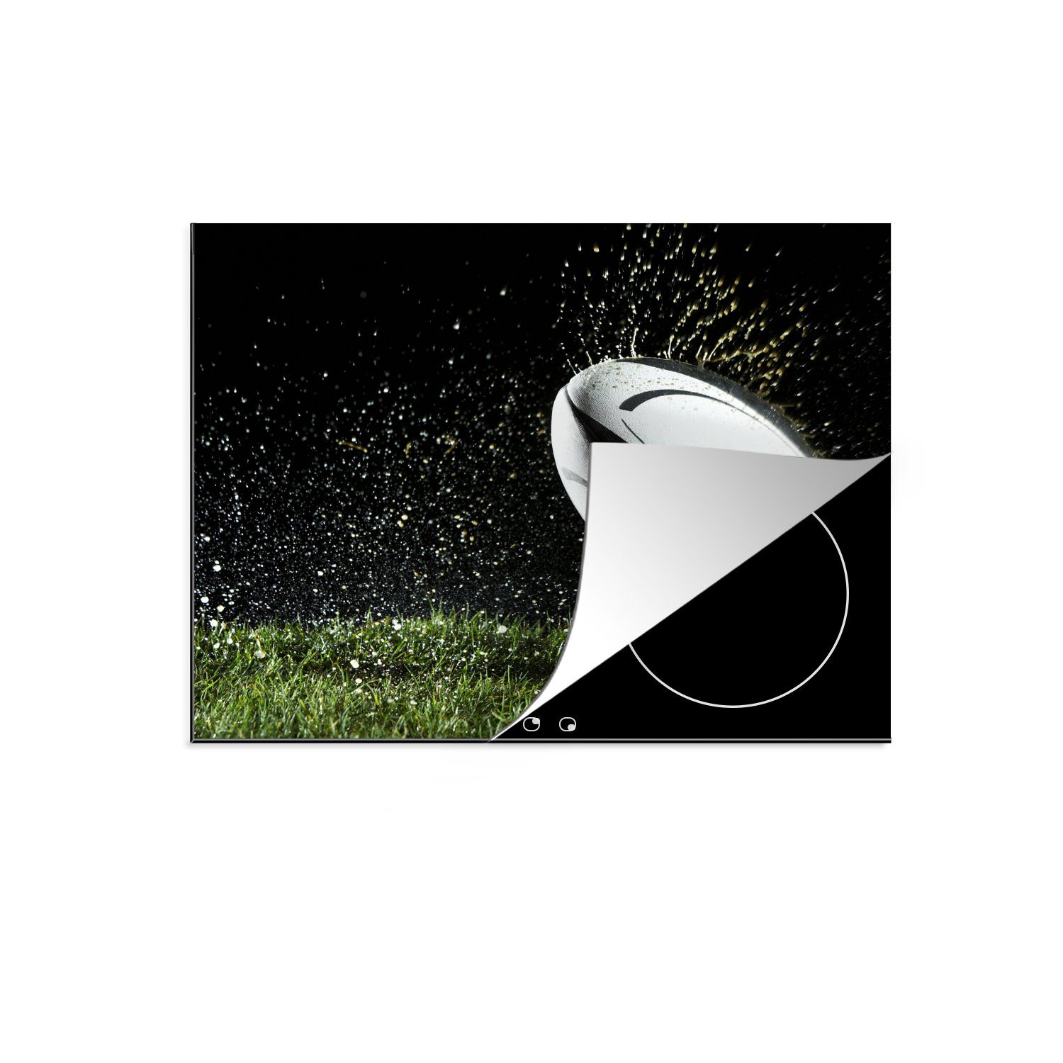 MuchoWow Herdblende-/Abdeckplatte Ein Rugbyball rollt auf dem Rasen, Vinyl, (1 tlg), 70x52 cm, Mobile Arbeitsfläche nutzbar, Ceranfeldabdeckung