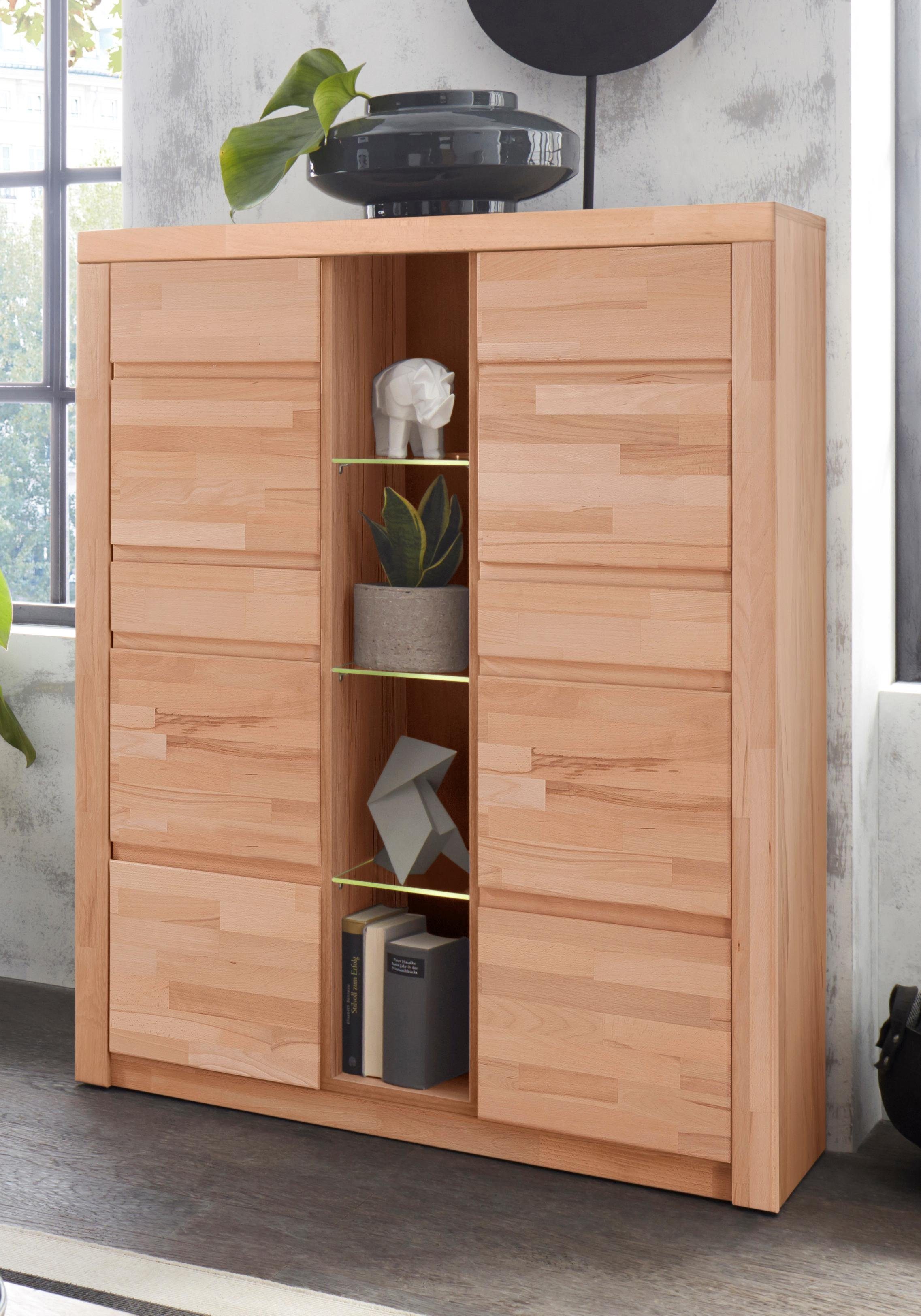 OTTO home Highboard Silkeborg Fronten & Leisten aus Massivholz, Kospus aus Melamin, B/T/H: 90/35/125cm, 6 Melamin & 3 Glas einlegeboden die variabel sind.