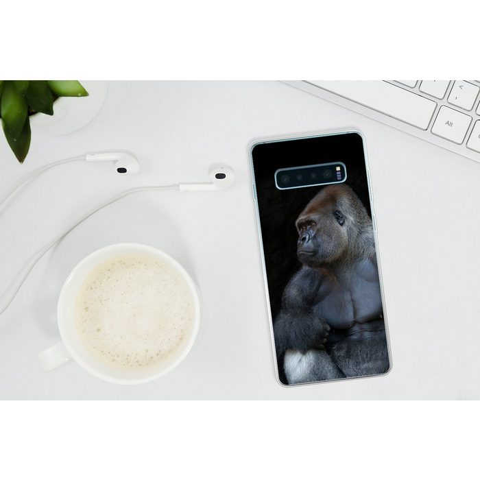 MuchoWow Handyhülle Ein muskulöser Gorilla auf schwarzem Hintergrund Phone Case Handyhülle Samsung Galaxy S10+ Silikon Schutzhülle FN11503