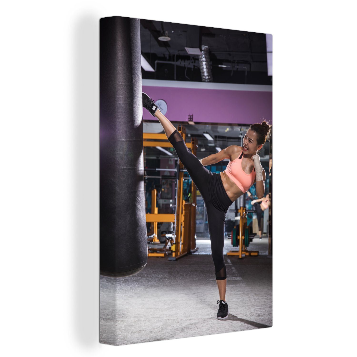OneMillionCanvasses® Leinwandbild Eine junge Frau betreibt Kickboxen, (1 St), Leinwandbild fertig bespannt inkl. Zackenaufhänger, Gemälde, 20x30 cm